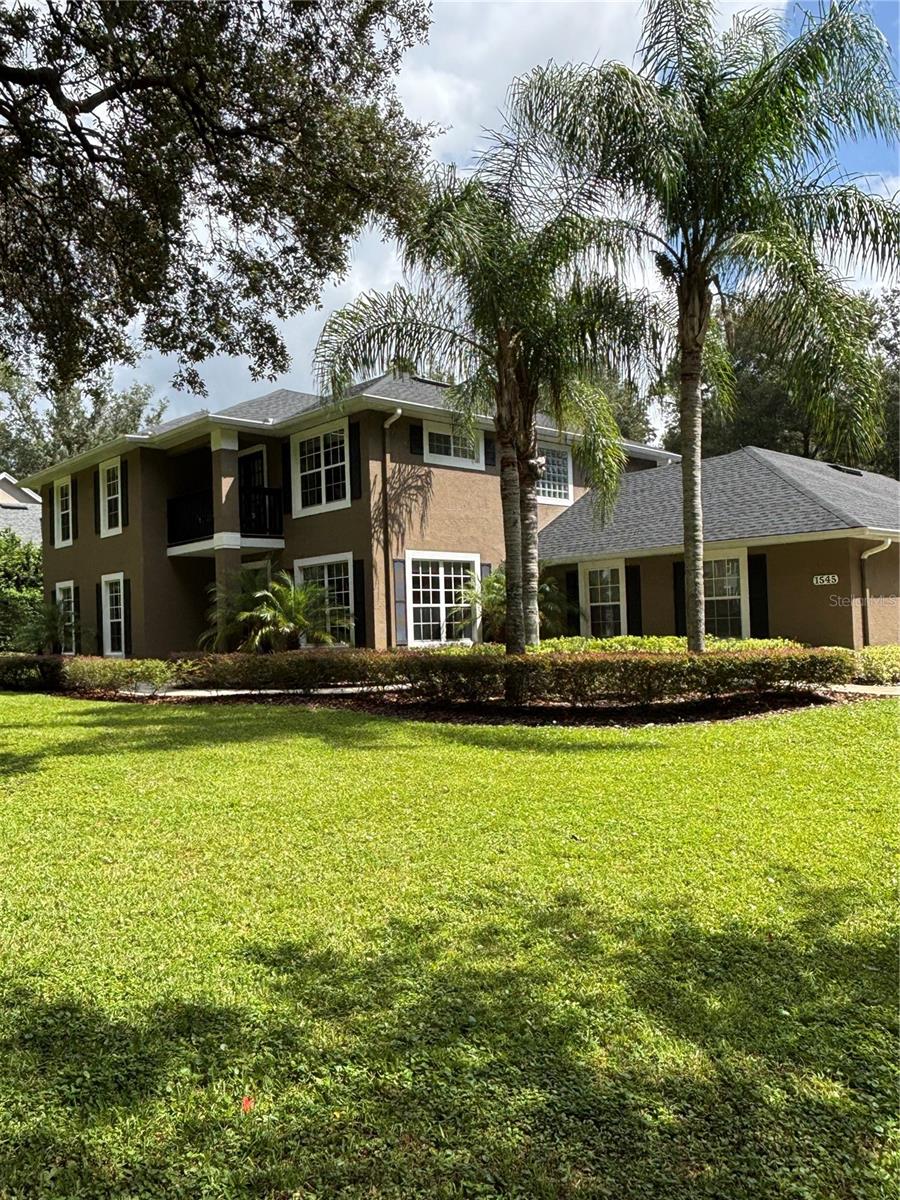 First Time on the Market – One Owner Custom Arthur Rutenberg POOL Home, OVERSIZED 3 Bay attached GARAGE, on .91 ACRE. You will know this is a special place when you see the huge live oak welcoming you in. This sprawling oak is hundreds of years old. Pride of ownership shines in this one-owner, custom-built 5BR/3BA home designed with quality and detail throughout. This two story beauty is constructed with cement BLOCK on both levels (no wood frame), offering long-lasting strength and style. Enjoy peace of mind with NEW roof, new hot water heater, two new HVAC systems, new toilets, updated electric inside & out, resurfaced pool with new pump. Remodeled kitchen & baths (2023). Inside, you’ll find: Spacious first floor ACTIVITY/GAME Room with rich cherry wood floors, and a wall of closets for storage. Crown moulding & wood-look ceramic tile in main living areas. Great Room (Family Room) with wood-burning fireplace and cherry floors. Formal Dining Space and separate Dinette plus a beautiful Breakfast Bar Island lets you entertain with flexibility.
Gourmet kitchen with stainless appliances, granite counters, cabinets with glass front tops, farmhouse sink, oversized breakfast island with storage, and large hall pantry.
Triple disappearing sliders open the home to a stunning 12x36 screened lanai with trussed roof, porcelain tile, and 220 hook-up for a hot tub. The lanai overlooks the 20x44 open paver patio and steps down to the 18x30 sparkling pool with full paver deck — perfect for entertaining or relaxing. There is a first floor pool bath with shower tub combo, dual sinks and granite counters, that also serves guests. Upstairs, the PRIMARY SUITE offers vaulted ceilings, french doors to 8x5 deck/sitting porch to catch the last rays of the setting sun, an EN-SUITE bath with private garden tub and glass block window lighting, large walk-in shower, double sinks, granite counters, dual closets, private water closet. Hall bathroom strategically located on 2nd floor for guests has dual sinks, granite counters and shower tub combo. All guest bedrooms are bamboo or LVP flooring, have closets with mirrored doors and are comfortably sized. Car enthusiasts will love the oversized garage which can hold 5 vehicles. Garage also offers 2 sets of pull down stairs for attic access/storage. This rare gem blends timeless craftsmanship with modern updates, making it the perfect place to call home. Don’t miss your chance to own this one-of-a-kind Arthur Rutenberg masterpiece!