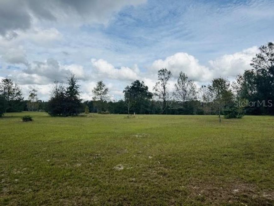 BEAUTIFUL 5 ACRES in EMERALD FARMS! No deed restrictions and no HOA! Mostly cleared with beautiful trees abounding it! No drainage problems and no flooding. Located between Bell and Branford for easy access to either. Local dining, shopping, and medical amenities only 10 miles away. Turn this into your next homesite! Close to the Suwannee and Santa Fe Rivers, along with several natural freshwater springs. Located in Gilchrist County with low property taxes and "A" rated schools. Call today for more information.
