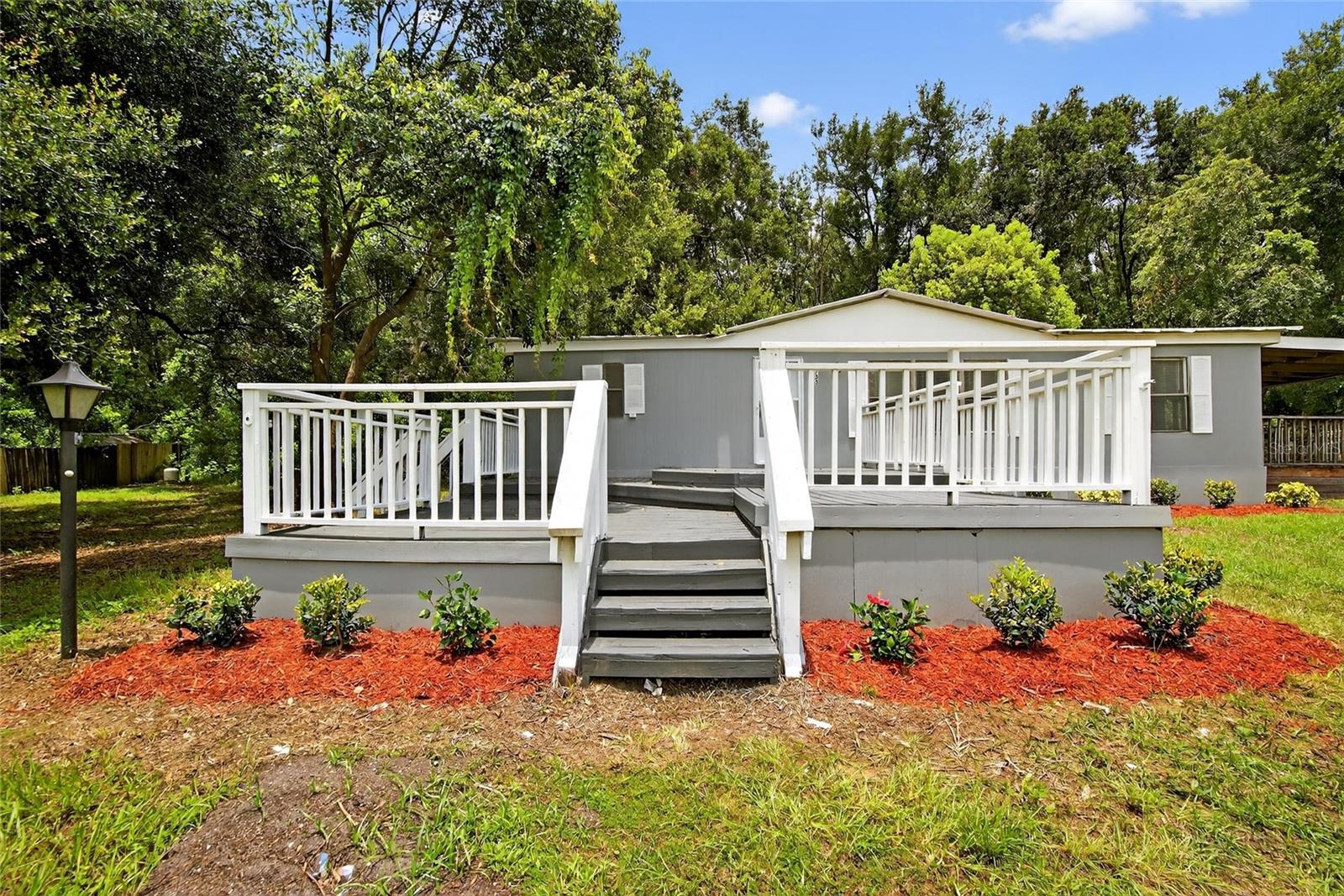Under contract-accepting backup offers. Completely Renovated 3 Bedroom, 2 Bath Home on Nearly an Acre!
Step inside this beautifully updated home featuring a functional split floor plan designed for comfort and privacy. The interior offers a spacious living room, designated dining area, and a modern kitchen outfitted with stainless steel appliances. Enjoy the convenience of an indoor laundry room and the comfort of a private primary suite tucked away from the guest bedrooms. Outdoor living is just as inviting, with a large sundeck at the front of the home and a covered deck on the side—perfect for relaxing or entertaining. The property is attractively landscaped and includes a sturdy block storage building. Situated on a generous 0.9-acre lot with well and septic, this home offers the peace and space of country-style living while still being conveniently located.