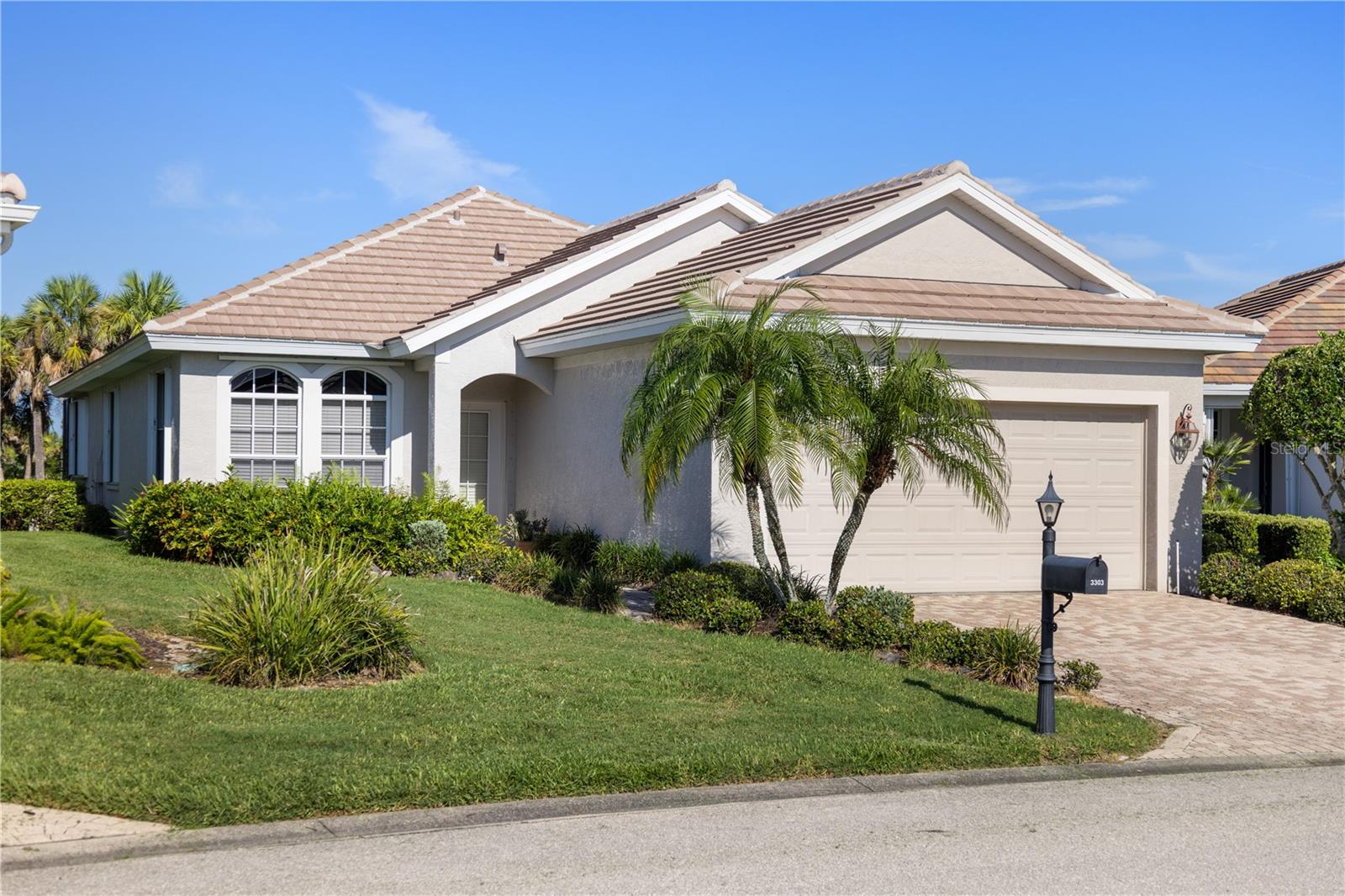 This beautiful Riverwood home is perfect for the buyer who likes a private, quiet setting and nature. Located in the Osprey Landing neighborhood, this home backs up to the lush greenbelt and sunsets from the western lanai. Designed with an open concept style, the home is open from the kitchen to the breakfast bar, dining space and living room. Large sliding doors lead to the covered and uncovered lanai with an inground spa for relaxation. Elevated ceilings and architectural details are consistent throughout the home and it has been beautifully maintained. Roof and water heater were replaced in 2024 and there is hurricane protection on all windows in the form of a roll down door, accordion shutters and panels. All 3 bedrooms are spacious and 2 guest rooms could work as a den or office. Master bedroom has large windows, a door to the lanai, walk in and standard closet. En suite bathroom has a walk in shower, garden tub, dual sink vanity and private lavatory. Spacious kitchen includes a dinette area surrounded by windows, granite countertops, breakfast bar that seats at least 4 and a pantry. Third bedroom is located at the front of the house and has a guest bathroom in close proximity. Interior laundry room sports shelving for extra storage and quick access to the 2 car garage. Riverwood is a beautifully maintained and lush community offering a wide variety of activities and abundant nature. There are opportunities to join private clubs within the community or you can just enjoy the community ones, either way you feel like you are living in an exclusive resort. Englewood Beach is approximately 20 minutes away and there are several shopping and dining opportunities in a short distance.