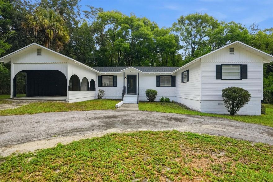 One or more photo(s) has been virtually staged. MOVE-IN READY!! COMPLETELY REMODELED!! BRAND NEW ROOF 2026!! GORGEOUS WOOD BEAM CEILINGS!! 3 bedrooms + 2 bathrooms (gorgeous) + 2 car carport + nestled on almost 1/3 of an acre (oversized lot for the area)! NO HOA!! NO FLOOD!! Circle driveway for extra parking! All new luxury vinyl plank flooring throughout! Remodeled kitchen with all new white shaker cabinets + beautiful wood countertops + new stainless steel appliances!! BOTH bathrooms are remodeled with impressive ceramic tiles tub/showers + new cabinets/vanities + new toilets! Freshly painted inside and outside! Located in beautiful Brooksville off Mondon Hill Road, near US 41. 

Close to everything!! Shoppes, restaurants, hospitals, schools...everything!! Less than 25 minutes to kayaking, paddle-boarding, and swimming with the manatees in the clear Weeki Wachee River or enjoying a day at Buccaneer Bay Water Park!! 30 minutes to the sunsets at Pine Island, boating and fishing!! Less than 15 minutes to the Suncoast Parkway for quick and easy access to Tampa International Airport and for all the fun that Tampa Bay has to offer!! 1 hour + to TOP US BEACHES!! 1.5 hours to Disney World and Universal Studios and all the theme parks!! The City of Brooksville is our own little Hallmark Town with lots of festivals, farmer's markets, craft and art shows, music on the square, horse-drawn carrigae rides at Christmas, parades, and so much more!!