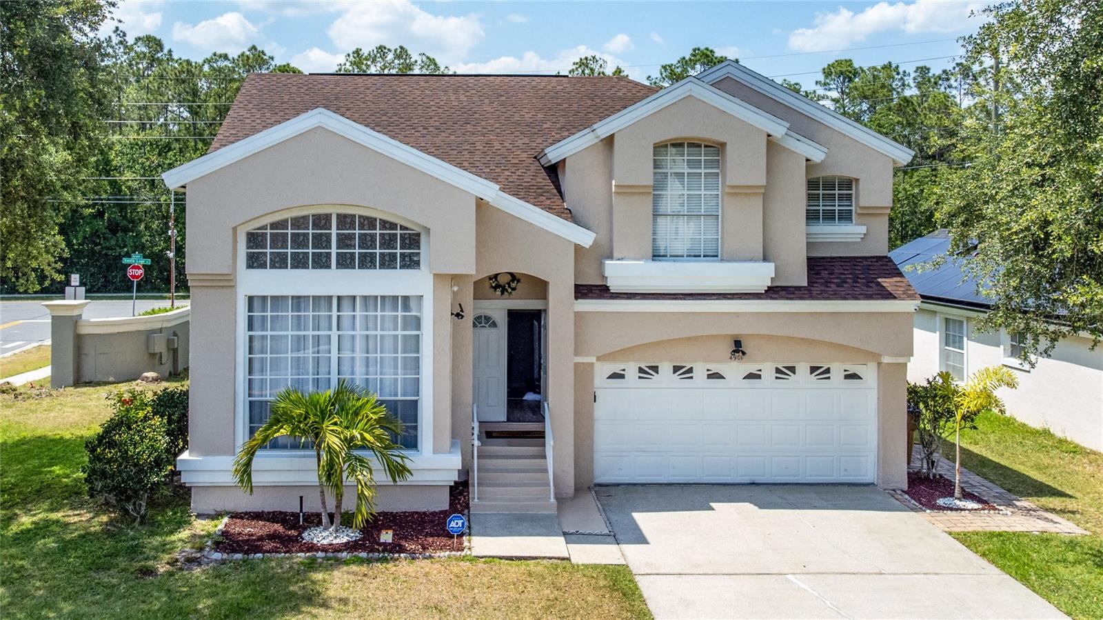 Come check out this immaculate 4 Bedroom, 2.5 Bathroom, Single-Family Home corner lot located in Bay Pointe. Step inside this home to be greeted by a formal living and dining space with two-story windows. This home has been completely renovated with new floors, paint, electrical and plumbing. Further into the home is a fully- equipped kitchen which overlooks a large family room. Enjoy the private, screened-in heated pool and lanai, perfect for melting your day away. The primary suite is located on the second floor and contains an ensuite bathroom with double vanity, garden tub, and separate walk-in shower. There are additional bedrooms located on the second floor along with a full bathroom. The Bay Pointe community delivers excellent amenities, including a community pool and tennis court. This home is close to all major theme park attractions, restaurants, and shopping centers, making it the perfect home for a primary residence.