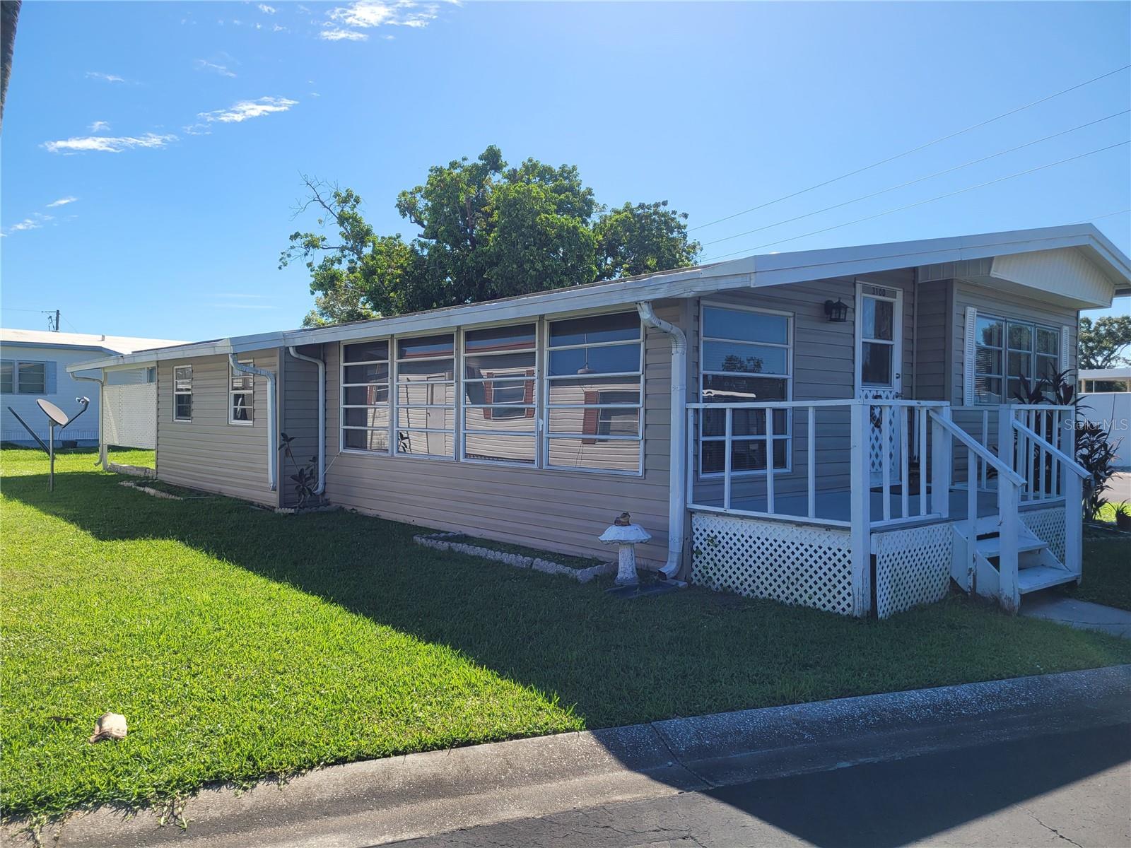 Are you tired of high lot rental fees? Say no more! Come see this lovely 2/1 in the 55+ DEED-OWNED Community of Terra Siesta! You know what they say, LOCATION, LOCATION, LOCATION! And this location can't be beat! You will be right in the heart of Ellenton! This quaint abode lives large with it's open floorplan, spacious primary bedroom and a nice sized secondary bedroom. This turnkey furnished home is completely move in ready. This home has a large bathroom with 2 storage areas. Both Bedrooms have good sized closets and storage spaces, so you will have plenty of room for your things. In addition, you will have an indoor laundry, located inside the large shed that is under the roof tresses. It is large enough for the golf cart and many other items, giving you all the added storage to suit your needs. In addition to all that, this home has something extra special, it sits on a LARGE corner lot at the end of the street. This gives you tons of privacy in this large park. Take a short golf cart ride to the clubhouse, 2 pools, pickleball courts, shuffleboard, pools and more! There is always plenty to do in this very active community. This wonderful deed-owned community has NO LOT RENT, and HOA is only $211 per month, which includes trash pickup and water. Terra Siesta is a great community filled with fun activities and events, just step outside and you will see! There are regular activities, including dinner parties, day trips, cards/games and dancing so come enjoy the amenities, become an active volunteer or just enjoy the peace and tranquility of this desirable community. Terra Siesta is also centrally located to shopping, restaurants and a short drive to Gulf Coast Beaches. You will be delighted to call this turnkey furnished 2 bedroom, 1 bathroom home yours. This is definitely one you will not want to miss. Make your appointment today!
