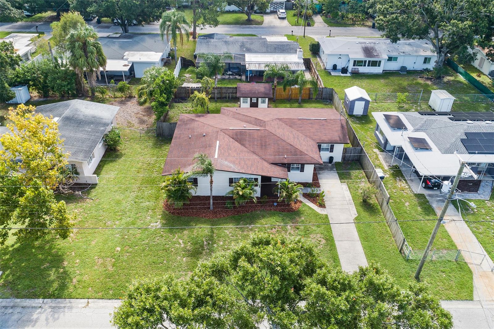 This beautifully maintained 3-bedroom, 2-bathroom home is perfectly situated in the heart of Tampa and offers an inviting open-concept layout with an oversized living space, ideal for entertaining. Featuring real hardwood flooring throughout and elegant shutters that add a touch of sophistication, this property blends style and functionality. The freshly painted exterior on both the house and shed enhances its curb appeal, while the spacious master suite includes a built-in closet for added convenience. Located within walking distance to Kenneth E. Adum K-8 Magnet School, this home is perfect for families seeking top-rated education nearby. Best of all, it did not experience any flooding during last year’s storms, offering peace of mind for years to come. Entertainment center can be removed as well.