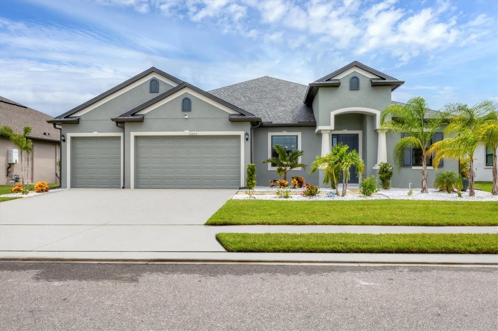 Nearly New 5-Bedroom, 3-Bath Home with Over 3,000 Sq. Ft. in Cross Creek!
Welcome home to your Florida retreat in the highly desirable Cross Creek community of Parrish! Built in 2023, this impressive single-story residence combines modern design, exceptional space, and move-in-ready convenience with over 3,000 sq. ft. of living area, 5 bedrooms, 3 full baths, and a spacious 3-car garage.
Step inside and be wowed by the expansive open-concept floor plan, enhanced by sleek upgraded tile flooring that flows seamlessly throughout the main living spaces. The gourmet kitchen takes center stage, overlooking the dining and living areas, and features stylish finishes and thoughtful design—perfect for everyday living and entertaining alike.
With 5 generously sized bedrooms, this home provides plenty of flexibility for family, guests, or even a dedicated office or hobby space. Every detail has been considered, offering a nearly brand-new, turnkey lifestyle with nothing left to do but move in. No window shutters needed, all the windows including the sliding glass doors to the lanai are Hurricane Impact glass!
Outside your front door, Cross Creek offers the resort-style amenities Florida living is known for. Relax at the lagoon-style pool with waterslide, let the kids enjoy the splash pad and tot lot, or connect with neighbors at the dog park. Walking trails, a basketball court, and a welcoming clubhouse round out the community experience. Conveniently located near I-75 and US-301, you’ll enjoy easy access to shopping, dining, and the world-class Gulf Coast beaches. Don’t miss this opportunity to own a nearly new home in one of Parrish’s most sought-after neighborhoods. Schedule your private tour today and step into the Florida lifestyle you’ve been dreaming of!