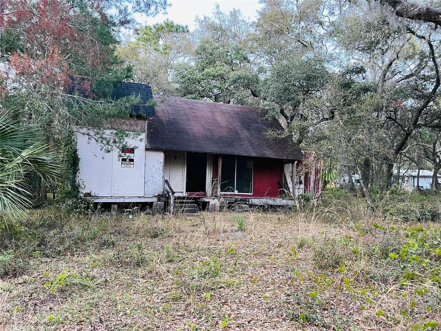 Discover the potential of this rustic A-frame style cabin located in the heart of Ocklawaha. Nestled on a wooded lot surrounded by mature trees, this property offers privacy and endless renovation opportunities. The home features 2 levels with open living space, a well on site, and plenty of room for customization.
While the house requires a full rehab (roof, windows, interior finishes, and utilities), it provides a solid foundation for investors, builders, or buyers looking to create a vacation home, Airbnb, or private retreat. With its natural setting and spacious lot, this is your chance to transform a hidden gem into a unique Florida escape. 
Key Features:
A-frame cabin style home, 2 levels, open layout, rustic charm, Wooded lot with mature trees, On-site well (needs inspection), Great investment or fixer-upper project
Bring your vision and creativity—this property has incredible upside potential!