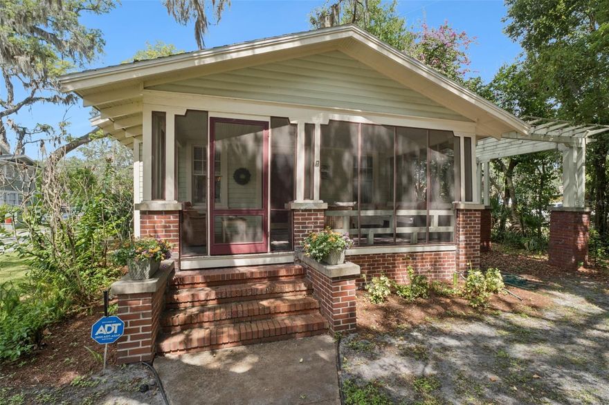 Welcome to 2120 Sanford Avenue, a classic Sanford bungalow filled with charm, character, and thoughtful updates. Nestled beneath a majestic shade oak on a corner lot, this lovingly maintained home has been cherished by the same owner for more than 20 years.
Located in Sanford's popular golf cart district, you'll love the convenience of cruising to downtown restaurants, breweries, shops, festivals, and the waterfront. The inviting screened front porch is the perfect place to enjoy your morning coffee, unwind after work, or spend time with family and pets.
Inside, original hardwood floors, historic windows, a decorative fireplace, and a traditional bungalow floor plan create a warm and welcoming atmosphere. The dining room features charming built-in window seating, while the bright kitchen offers classic white cabinetry, open shelving, abundant counter space, and a convenient butler's pantry for additional storage.
Two spacious bedrooms and a centrally located bath provide comfortable living, while major system updates offer peace of mind, including a newer roof (2023), HVAC (2024), updated plumbing and electrical, water heater (2022), and termite tenting completed in April 2026 with a transferable bond.
Outside, cottage-style landscaping, a rear deck, brick pathways, detached garage, and additional parking create a private backyard retreat. Historic charm, updated systems, and an unbeatable Sanford lifestyle—this is the kind of bungalow people wait for.