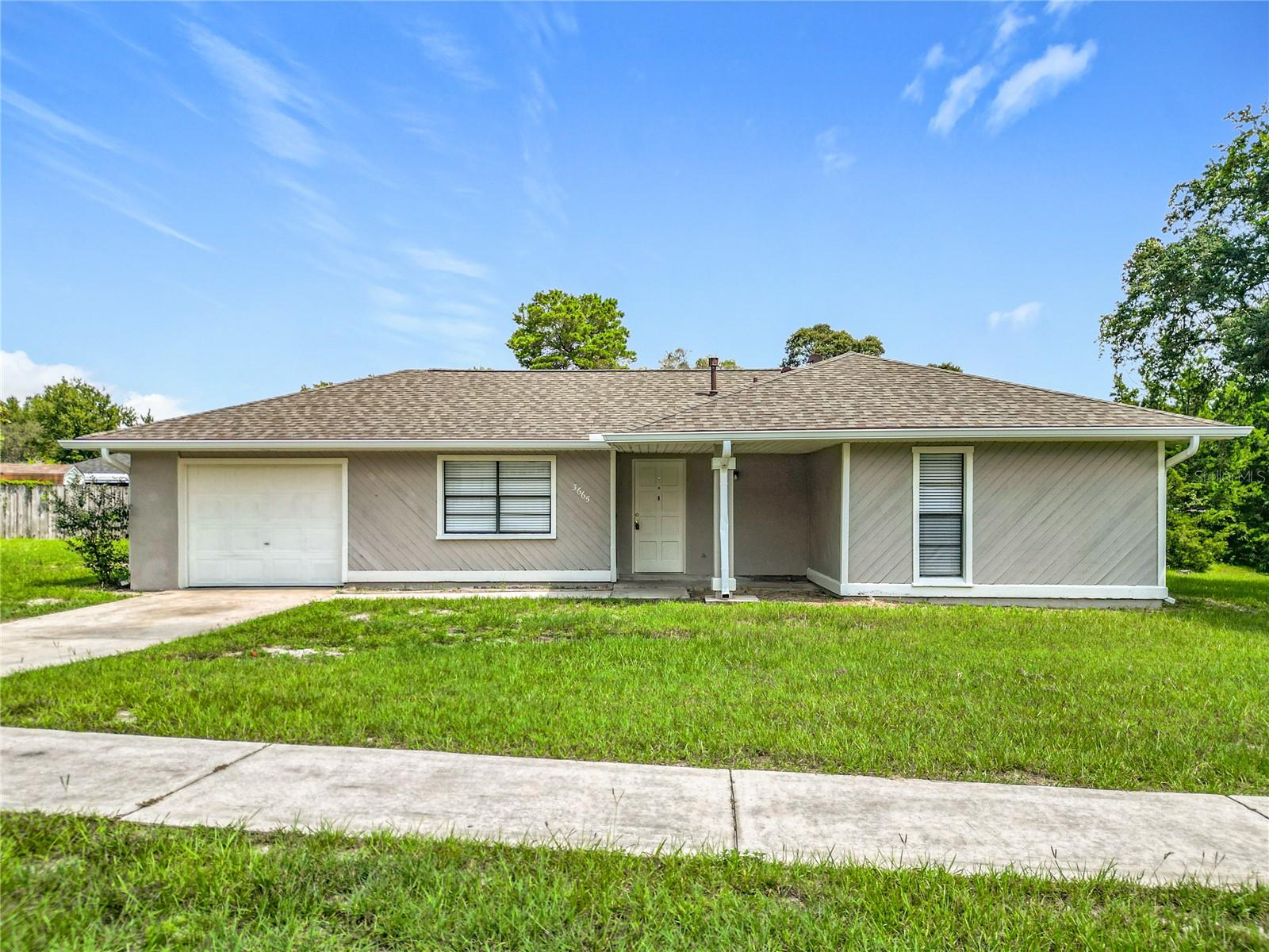 Move-in ready 2 bedroom, 2 bath home with laminate in main areas and carpet in bedrooms. Features a spacious yard and one-car garage. Conveniently located near schools, highways, and main roads.