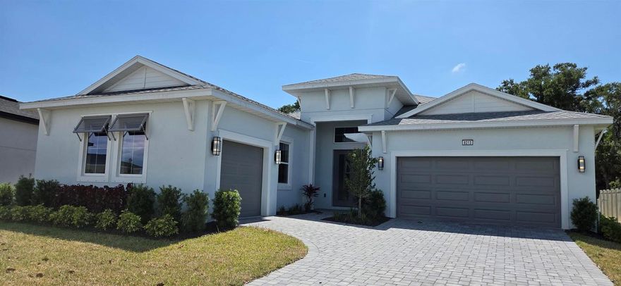 Beautiful quick move-in, single-story home located in desirable Biscayne Landing in Parrish, FL. This thoughtfully designed residence features an open-concept floor plan with soaring 10-foot ceilings and abundant natural light throughout. The spacious kitchen is a true centerpiece, complete with an oversized island, ample cabinetry, and generous counter space, all seamlessly flowing into the breakfast area and expansive family room—perfect for everyday living and entertaining. A casual dining room at the front of the home provides an inviting space for gatherings. The flexible fourth bedroom can easily serve as a home office, playroom, or additional living area to suit your needs. The private primary suite offers a relaxing retreat with a large walk-in closet and a well-appointed ensuite bath featuring dual vanities and a walk-in shower. Two additional bedrooms include ample closet space and share a full bathroom. Practical features such as a convenient laundry room near the garage entry and a mudroom drop zone enhance everyday functionality. The three-car garage, with a two-bay plus separate one-bay configuration, offers added flexibility for storage or hobbies. Enjoy Florida living outdoors with easy access to the rear patio from the breakfast area—perfect for relaxing or entertaining.
