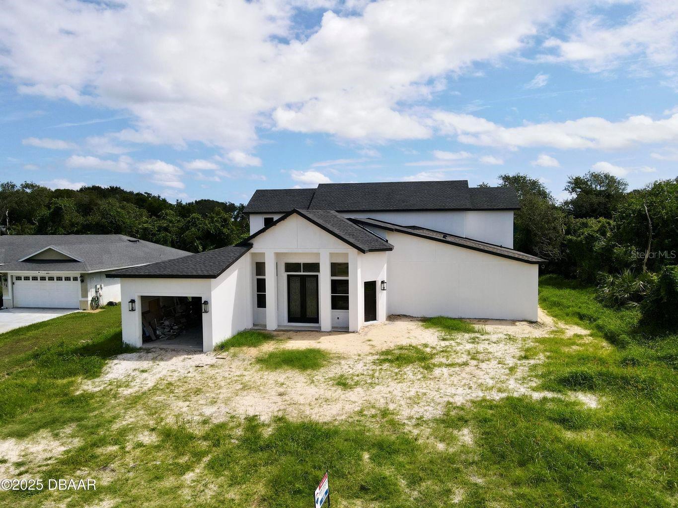 Under Construction. Amazing Investment potential, this home is in the final stages of construction. This is your opportunity to complete the construction of the home and have instant equity. The home boasts with beauty, huge primary bedroom with enclosed porch, Mother in law quarters, Theater room, massive back porch - summer kitchen ready and so much more! Hurricane shutters too. We have estimated the value between $815,000-820,000 with about $60,000 left in production costs. Come take a look and evaluate for yourself. Property sold AS-IS.
