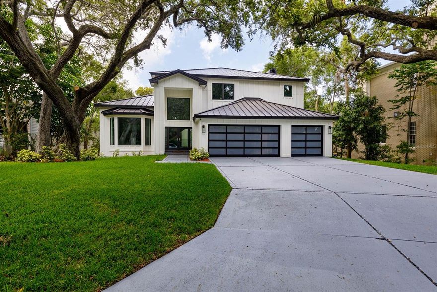 Located in historic Belleair, Florida comes this amazing modern masterpiece. The superior restoration and renovation was done in collaboration with WKM Restoration Group, known for their commercial construction and AAA Services of Central Florida, known for their full scale renovations. The home was commercially restored down to the studs from top to bottom. Fundamentally, this is a new home with custom finishes throughout combined with only the most luxurious materials. The developers of this home have built and renovated many premier properties in the Tampa Bay area. The gourmet chef’s kitchen showcases top-of-the-line Bertazzoni Italian appliances, natural quartzite with
waterfall edges, and a large kitchen island. Enjoy the beauty of the white maple flooring throughout, a show-stopper custom floating staircase, high-end designer finishes, and an incredibly luxe marble en-suite master bathroom with an oversized walk in shower and a freestanding soaking tub with garden views. The lower level has a large family room with a wet bar, wine cellar, two bedrooms and an oversized fitness
center room. The living room on the main floor features an exquisite modern custom fireplace. Discover the lifestyle of this golf cart friendly
community. The home is located in a sought-after neighborhood and is only 100 feet from the entrance of the prestigious Belleair Country Club and is also only minutes from the highly rated Pelican Golf Club, restaurants, and award-winning beaches. The HOA for this home allows you to skip the waiting list for the Belleair Country Club and give you 25% off of the initiation fee. This home is truly a once-in-a-lifetime property that combines luxury living with impeccable construction and elite finishes.