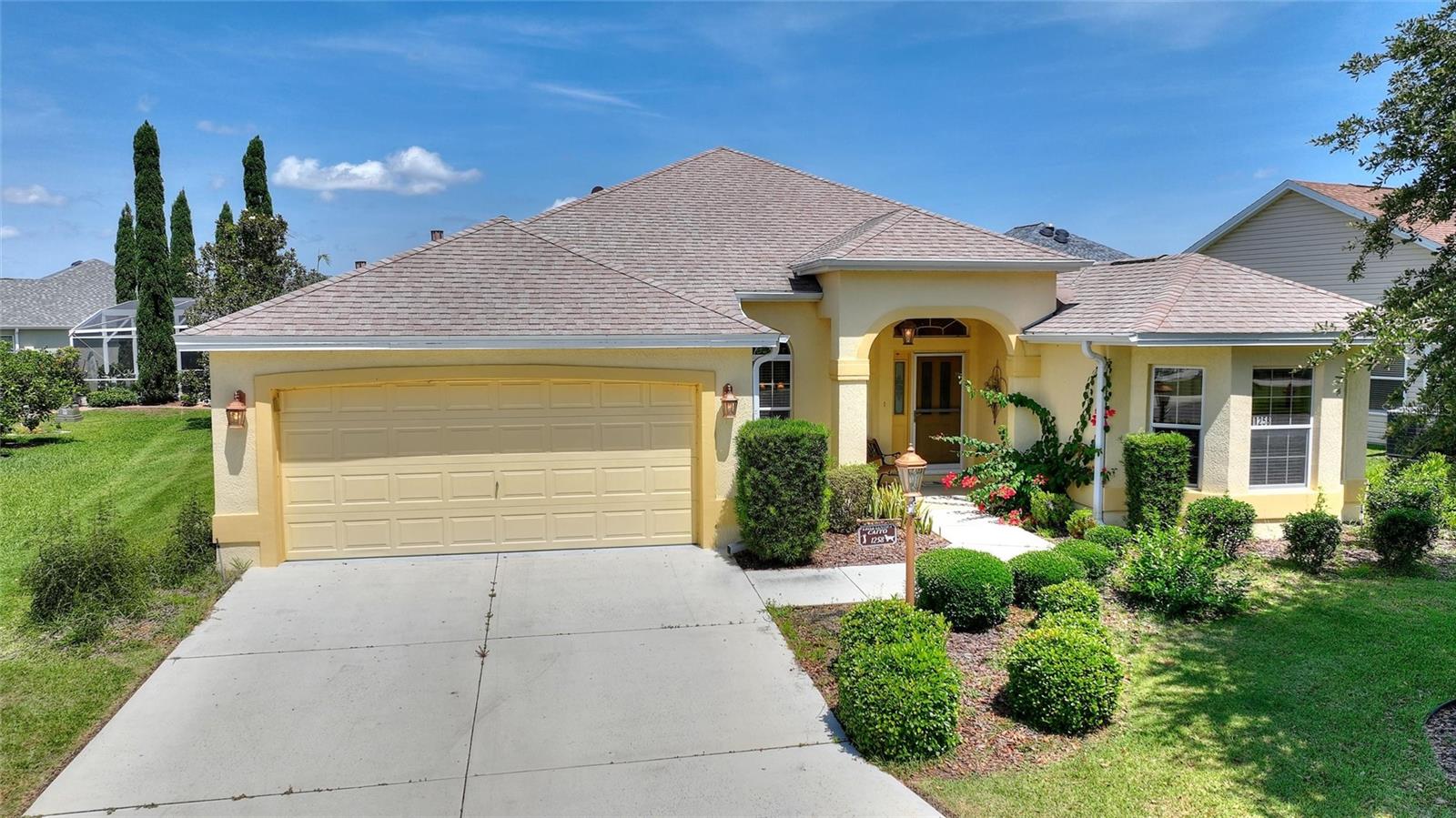 Welcome to your ideal Florida retreat, perfectly positioned in one of The Villages’ most desirable neighborhoods—just moments from Lake Sumter Landing, golf courses, dining, shopping, and entertainment. This meticulously maintained 3-bedroom, 2-bath ranch-style home sits on a beautifully landscaped cul-de-sac lot and offers the perfect blend of comfort, elegance, and low-maintenance living. Offered fully furnished, this home allows you to settle in and start enjoying The Villages lifestyle from day one. Inside, the open-concept floor plan is designed for both relaxation and entertaining, featuring granite countertops, rich wood cabinetry, upgraded flooring and lighting, and expansive sliding glass doors that seamlessly connect the indoors to your private lanai oasis. The outdoor living space is a standout, complete with a fully equipped outdoor kitchen, making it the perfect setting for dining, entertaining guests, or simply enjoying the Florida sunshine in peace and privacy. Retreat to the spacious primary suite, where you’ll find a large walk-in closet, dual vanities, and a private water closet—all thoughtfully designed for comfort and functionality. Whether you're seeking a seasonal escape or a full-time residence, this home delivers on location, quality, and lifestyle. Don’t miss this exceptional opportunity to rent a piece of paradise!