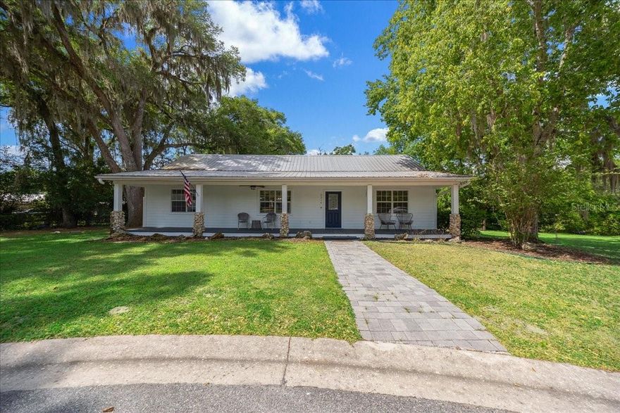 Charming, fully remodeled home tucked away on a quiet cul-de-sac in Belleview! This 3 bedroom, 2 bathroom property offers the perfect blend of modern updates and cozy character. Featuring a durable metal roof, new A/C, and new water heater, you can enjoy peace of mind for years to come. Open and inviting layout with updated finishes throughout, including a beautifully renovated kitchen with stylish cabinetry, countertops, and backsplash. The spacious living area is highlighted by a stunning fireplace, creating the perfect focal point for relaxing or entertaining. Enjoy Florida living at its best with both a welcoming front porch and a large back deck with a fenced in back yard! Move in ready!