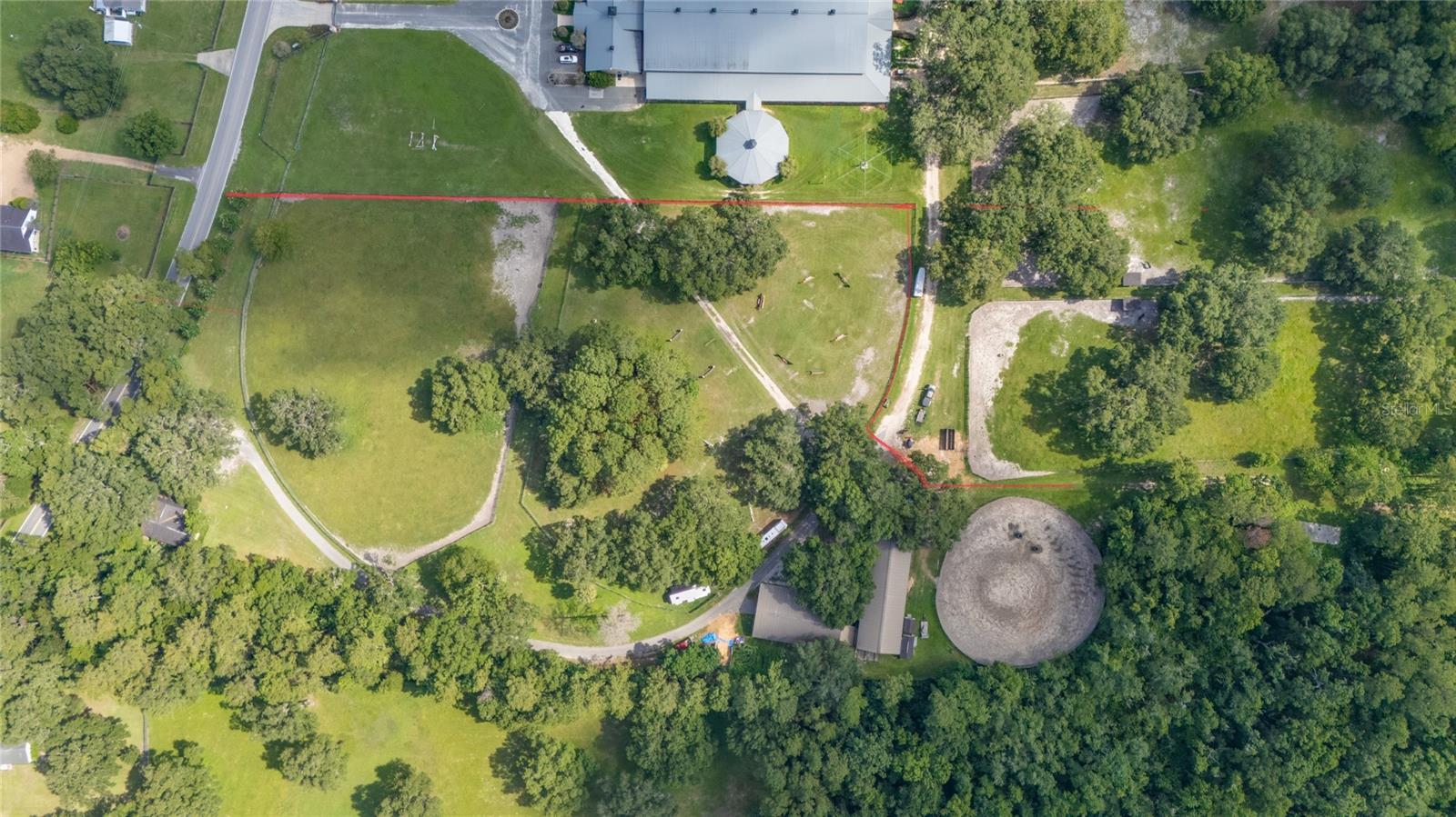 Sunshine State Equestrian Dream – Prime Location & Endless Potential in Ocala Florida Marion County
Welcome to an exceptional opportunity in the heart of Florida’s horse country! Nestled in the rapidly growing Ocala community, this approximately 10-acre (±) parcel is part of a larger estate and offers everything you need to create a true equestrian lifestyle — or a smart long-term investment.
Located just 10 minutes from WEC (World Equestrian Center) and 12 minutes from HITS, this is fully fenced and ideally positioned for riders, trainers, and horse lovers alike.
Highlights include:
• Two barns – one with 13 stalls, the second with 8 stalls, ready to house your equine team
• Two paddocks, a round pen, and 5 RV hookups for visiting clients, competitors, or guests
• Reliable water system and high-quality sandy loam soil ideal for healthy pastures and safe riding footing
• A 3-bedroom, 2-bath home full of potential — with a little TLC, this farm can be transformed into a charming facility
This property is not part of an HOA, giving you the freedom to design and operate as you see fit.
Experience the best of the Sunshine State lifestyle, where warm weather, open skies, and lush green landscapes meet the unmatched energy of Ocala’s equestrian community. With growth booming, demand for well-located equestrian properties is at an all-time high.
Whether you’re seeking a private training facility, a rental income producer, or a legacy property, this is a unique and limited opportunity — there’s truly nothing like it on the market. Call today for a private showing!!