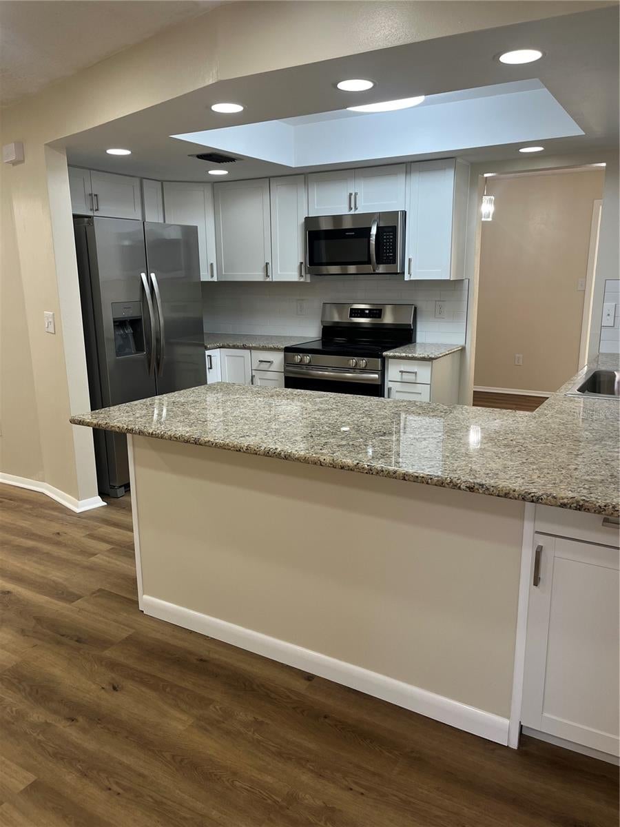 Photo of 2080 Sun Tree Circle N, Clearwater, FL 33763 (MLS # TB8556452)
