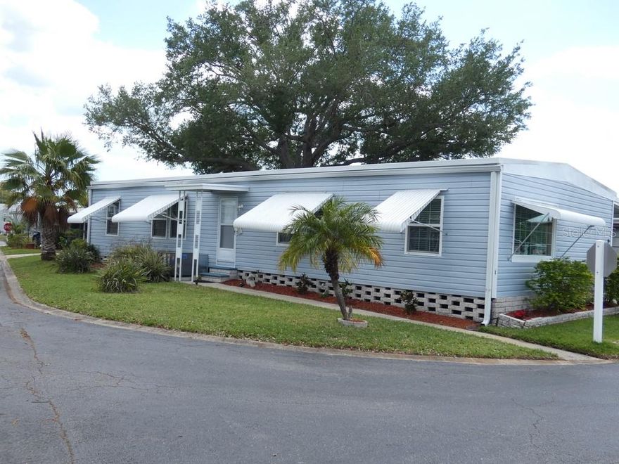 3 Bedroom, 2 Bathroom home with an open floor plan, located in a well-maintained 55+ community. This home offers a comfortable and functional layout with plenty of natural flow throughout the living spaces. The property features full utility connections including electric, cable, and phone, along with street lights and clean infrastructure throughout the community, with power lines typically below ground for a more polished look. The interior provides lots of cabinet space and a full home water filtration system, along with an AC replaced in 2022 and all ducks. The community offers a clubhouse, pool, fitness center, and allows golf cart access, creating an active and enjoyable lifestyle. Centrally located in Pinellas Park near shopping, restaurants, medical facilities, and major roads, providing convenient access to surrounding areas and nearby beaches.  Please view two videos: Tour 1 & Tour 2