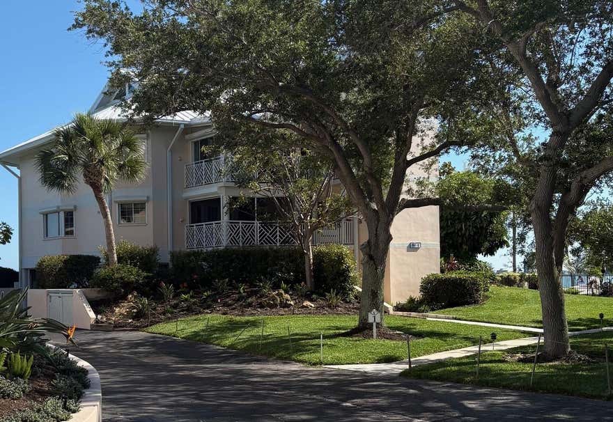 Look no further for a community that has it all. Nowhere in SW FL will you find anything as unique as the communities of the Placida Harbour Club. This comfortable and relaxing waterfront condo sits facing the waters of the IntraCoastal Waterway and Placida Harbour and offers outstanding views of the barrier islands. Lights from the docks, the Boca Grande Bridge and Causeway provide a beautiful view at night. Early-risers willl be treated to stunning sunrises out over the mangroves. Relax on the waterside lanai while you watch boats travel the waterways. The impressive views of the water are yours as soon as you enter the condo and  step into the light and airy open-concept living space.  The condo flows as beautifully as the water outside, from entry, to kitchen, through the dining room and living room. Sleep in the spacious primary bedroom with a slider door open and listen to the water gently soothe your soul, or listen to the variety of birds chirping to wake you up. The primary en suite bathroom hosts dual vanities, and a large shower with two shower-heads. The second bedroom has a slider with access to a screened in lanai.  Directly next to the second bedroom is fulll bath with tub and shower combo. The kitchen is complete with refrigerator/freezer with ice maker, range/oven, dishwasher(2022) and microwave(2023). Solid surface counters provide ample room for bakers, buffets and more.  Bldg 1 offers an elevator or under-roof staircase to the first floor, from the garage or outside. Lease a dedicated docks in the harbour that offers direct access to the Gulf via the ICW. Take the Harbour Club Ferry from the boat basin or your own boat to the Little Gasparilla Island pier and spend time at the beach.  Deeded beach access, a pool and clubhouse with bathrooms are there for owners and guests use.  All of the amenties of the Club, both mainland and Island Clubhouses, pools, walkways, and parking, are available to all Placida Harbour Club Communities.  The Mainland property includes two clubhouses and pools. Main Clubhouse has a new fitness center, yoga room, card rooms, kitchen, hot tub and restrooms, both poolside and inside. Tennis and pickleball courts and an active social calendar are part of your membership as well. Don't miss an opportunity to be where Old Florida meets Today's Florida.  Come and add some pizzaz to the wow you'll utter when you see the view.
