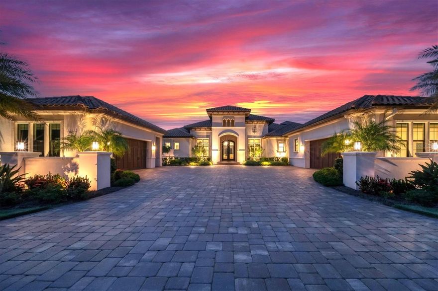 Custom designed Lee Wetherington residence with prime views is situated on a .76 acre parcel, with lake views looking across to a wooded preserve. This home in the exclusive and sought-after gated community of The Concession showcases an open floorplan, with generously proportioned spaces, exceptional craftsmanship, and a guest casita, all overlooking the large lanai area. When you enter the home, you’re greeted by a large living room with 14 ft ceilings and a 30 ft wall of sliding glass doors that pocket and disappear, creating a true indoor / outdoor living experience. The coffered ceiling in the living room is wood paneled. The main living areas feature wide plank engineered hardwood floors. The kitchen is a chef’s dream, with a double oven Wolf Range, Subzero Refrigerator, 2 Bosch dishwashers and an 11 ft center Island. The oversized hidden walk-in pantry has an abundance of shelves and a 2nd refrigerator. The open dining area fits a table that can comfortably seat 10 people. The Family room has corner-less sliding glass doors and overlooks the pool area. The resort-styled outdoor living and dining area features abundant open and under cover spaces, wood ceilings, summer kitchen, gathering area with gas fire pit, heated saltwater pool/spa, roll down hurricane protection, and a pool bath / casita. The casita is perfect as guest quarters or home gym. The primary suite features coffered ceilings, 2 large walk-in customized closets, and a luxurious spa like bath. On the other side of the home, you’ll find two generously sized guest suites with walk-in closets and en-suite baths. Just off the foyer there’s a large office with corner-less windows, so work is never boring, you can always enjoy the lake view. Upstairs is a large game room overlooking the lake, and a 4th bedroom and bath. Overall, there are 5 bedrooms, 5.5 baths contained within 6,011 sq ft of living space. Other highlights of this residence include a circular driveway flanked by stunning landscape, a generously proportioned laundry room with 2 washer / dryer sets, a large "florida basement", an attached 2-car garage and another detached 2 car garage, a whole home generator, a charge point EV charging station, and smart wired for easy systems management of lighting, security and home systems. This home encompasses everything you need to live your best Florida lifestyle. The Concession Golf Club has been ranked as one of the finest private golf clubs in the country. Within the gates of Concession, there are miles of picturesque paths for running, walking and bike-riding. Excellent schools, fabulous restaurants and a wide array of Lakewood Ranch and Sarasota area amenities at your fingertips make this highly sought-after neighborhood of estate homes a top choice.