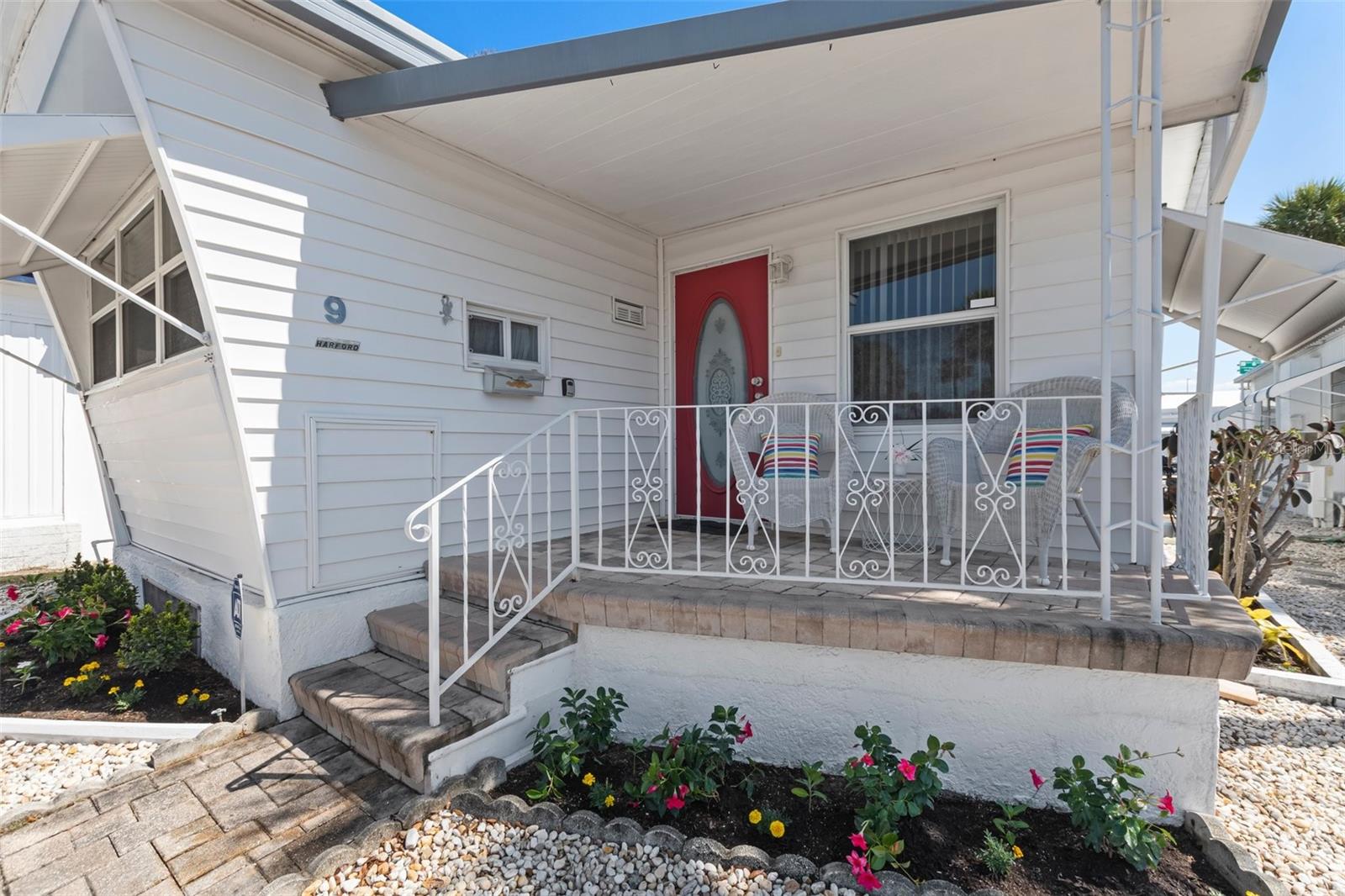 Own your "staycation" with this move-in ready furnished south Tampa gem! Regency Cove is a 55+ co-op owned gated exotic waterfront community consisting of 427 owners and requires no lot rent. This home is nestled conveniently across the street from the community pool, hot tub, shuffleboard, gym, library, main community parking lot, and other community amenities. Located between two boulevards, this home has no direct neighbors in front or in back. The home has one covered parking space and additional guest parking is available on the street in front of the home as well as in the community parking lot nearby. The open floor plan in this home ushers in natural light from all around, while the bamboo flooring warms the space. Granite kitchen counters offer an elevated touch of elegance to the kitchen while the abundant white cabinets provide ample storage. The bedroom offers a spacious 5'x6' walk-in closet. The bathroom is accessible from the hallway that leads to the bedroom and has been nicely updated with a walk-in shower that includes a built-in bench. Furniture and non-personal furnishings seen in photos and at showings stay with the home unless the buyer wishes for them to be removed. Laundry connections are available in the laundry/storage room that is accessible from the bedroom and provides an exterior door. The home's vapor barrier and insulation under the home were replaced 2024. Owning this home in this community will provide you with access to a number of community activities and amenities such as: church services, recently renovated heated pool and hot tub, two covered pavilions, boat docks, kayak put-in, fishing, fish cleaning salon, grilling stations, shuffleboard, library, gym, fitness classes, bingo, horseshoes, card games, pool tables, board games, puzzles, arts & crafts classes, water craft and trailer parking, and more. The very low HOA fee includes water, sewer, trash pickup, and groundskeeping. Near MacDill Air Force Base, St Petersburg, downtown Tampa, marinas, restaurants, venues, arenas, entertainment, and major roadways and bridges to access nearby beaches and all the Tampa Bay area has to offer. This home is priced to sell! Come and see this well maintained home in this beautiful community, and make your offer today! (Note: Please see the attached virtual tour!)