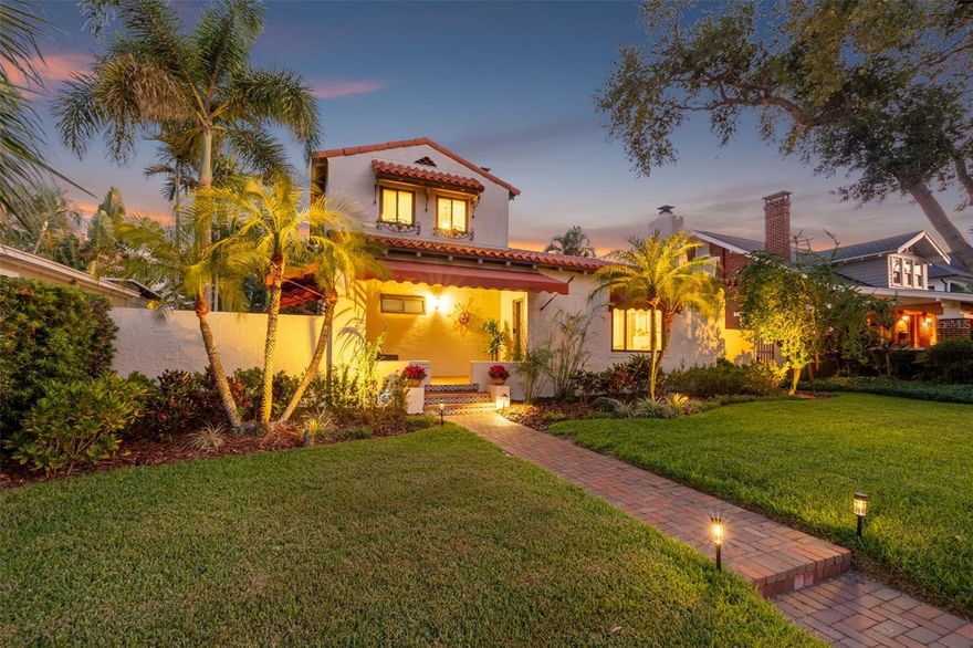 Nestled in one of St. Petersburg’s most desirable Old Northeast neighborhoods, this Spanish Mediterranean-style home offers timeless architectural charm featuring vaulted ceilings, exposed wood beams and a terracotta tile roof, situated just steps from the waterfront and a short stroll to downtown. From the moment you arrive, exceptional curb appeal sets the tone for what awaits inside. Step into a light-filled, open great room with rich hardwood floors and a cozy fireplace—perfect for relaxing or entertaining. A dedicated dining area flows seamlessly into a beautifully appointed chef's style kitchen featuring custom-crafted wood cabinetry, elegant quartzite countertops, Viking gas range, and Sub-Zero refrigerator surrounded by ample pantry storage—perfectly designed for both everyday living and entertaining. The spacious primary suite offers a peaceful retreat with a large, open custom closet and a recently updated en suite bath. Enjoy your morning coffee or unwind in the evening on the private balcony overlooking the meticulously manicured backyard—an outdoor oasis complete with mature royal palms, and a charming pergola draped in vibrant bougainvillea and a serene patio setting. Fully fenced for privacy, with plenty of room to add a pool. Two additional bedrooms and a full bath are conveniently located on the main living level, providing flexibility for family, guests, or a home office. Additional highlights include a detached two-car garage with convenient alley access and a newer HVAC system (2023). Enjoy morning walks along the waterfront and easy access to tennis courts, beach volleyball and public pool. Blocks away from vibrant downtown St. Petersburg offering world-class dining, charming sidewalk cafés, museums, theaters, and more. This is classic Florida living at its finest—where Mediterranean style, historic charm, and an unmatched location come together beautifully.