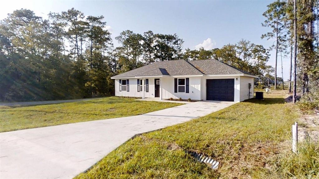 Photo of 24223 NW Water Oak Avenue, Dunnellon, FL 34431 (MLS # OM710876)