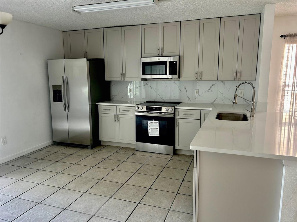 Photo of 1030 Crystal Bay Lane, Orlando, FL 32828 (MLS # O6453673)