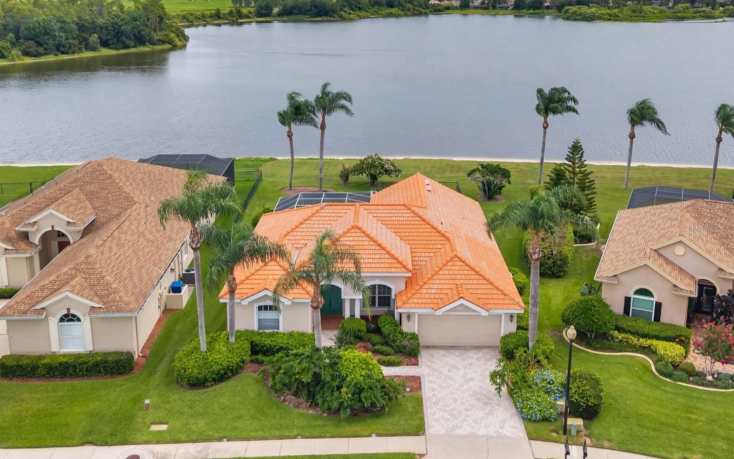 Welcome to this beautifully maintained 3 Bedroom, 2 Bath Pool home with a 2 Car Garage, perfectly positioned on a serene lake in the highly desirable Fox Wood community in Trinity, Florida. Owned by the original owner, this home features a durable Tile Roof and an open, functional layout filled with natural light and peaceful views. Inside, you’ll find an open layout that flows seamlessly from room to room, filled with tons of natural light and designed for easy living and entertaining. The spacious living and dining areas overlook the pool and lake, creating a serene and inviting atmosphere. The large, neutral kitchen offers plenty of counter and cabinet space, a breakfast bar, Large Island and a cozy eat-in nook with views of the backyard oasis. The split-bedroom floor plan provides privacy, with a generous primary suite featuring a walk-in closet and an en-suite bath with dual sinks and a walk-in shower. Step outside to your private screened-in pool and enjoy stunning Lake views—ideal for relaxing evenings or weekend gatherings. Inside, the split-bedroom design offers privacy, while the main living areas flow effortlessly for everyday living or entertaining. Located in a gated community with LOW HOA fees, Fox Wood offers wonderful amenities including parks, playgrounds, and beautifully landscaped common areas. Conveniently close to top-rated schools, shopping, dining, and medical centers, this home offers the perfect combination of comfort, location, and value. Don’t miss this rare opportunity to own a lakefront pool home in one of Trinity’s most sought-after neighborhoods.