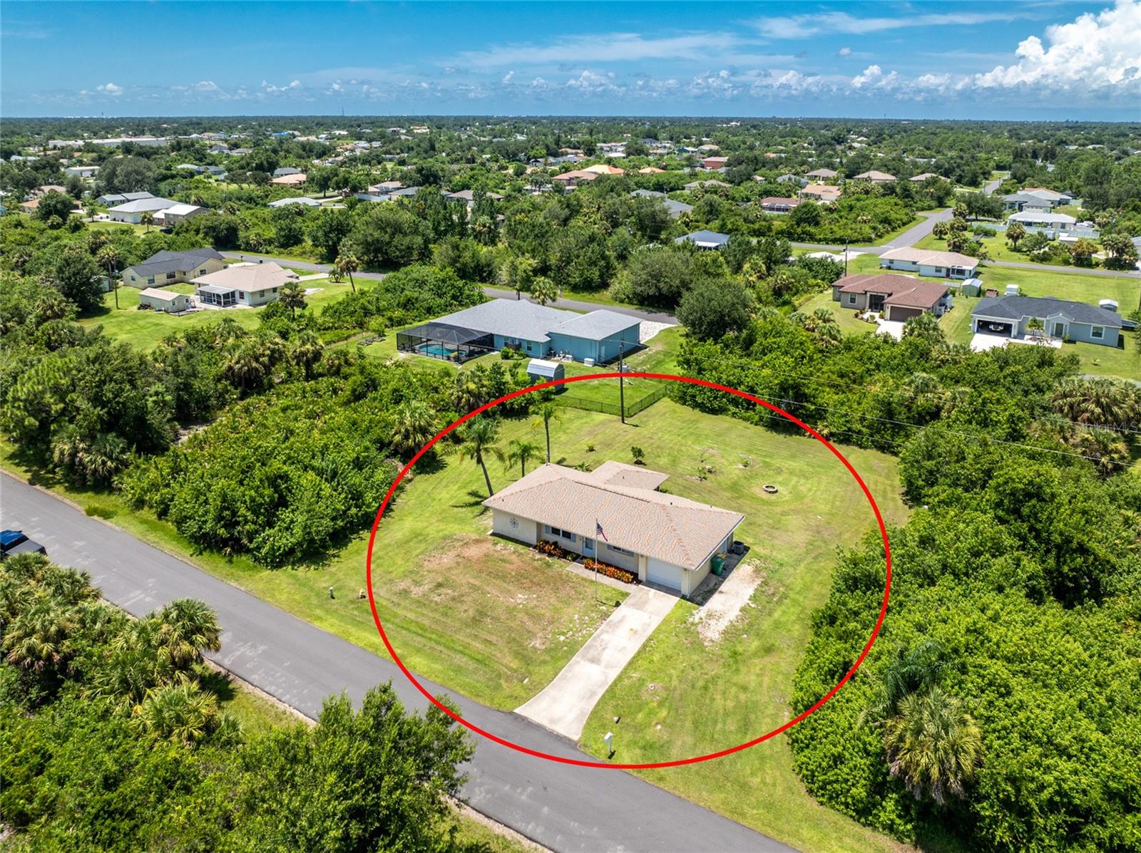 Searching for your slice of paradise? This East Englewood home sits in a no HOA, X flood zone neighborhood and is surrounded by vacant lots for added privacy. The well-maintained 2 bedroom, 2 bathroom, 1 car garage home is being sold turnkey furnished and offers thoughtful updates and the perfect blend of comfort and Florida lifestyle. The open split floor plan home also features a 2023 roof and 2017 A/C. Inside, cathedral ceilings fill the living room with natural light, creating a bright and welcoming space. Laminate flooring in the living room, kitchen and guest bathroom, along with tile in the master bathroom, keeps maintenance simple. The galley kitchen has white shaker-style cabinets, stainless steel appliances, a closet pantry, and a quaint bay window nook that could be used as a beverage station or for extra storage. A formal dining area offers views of the lanai and backyard through sliding glass doors. The spacious ensuite primary bedroom has a walk-in closet, oversized vanity, and step-in shower. The guest bedroom also features a walk-in closet and connects to the Jack and Jill style bathroom with convenient access from both the bedroom and kitchen area. A pavered screened lanai is the perfect spot to relax, while the large backyard is complete with several fruit trees, a cozy firepit, and plenty of space to add a pool, outdoor kitchen, or even your own pickleball court. Less than 8 miles to Englewood Beach and close to grocery stores, shopping, and medical facilities, this location also offers easy access to Historic Dearborn Street’s year-round events, the new Wellen Park for Atlanta Braves spring training, Charlotte Sports Park for Rays games, Port Charlotte shopping, and Venice for art festivals and downtown activities. If you're seeking the Florida sunshine and lifestyle, 6175 Lomax Street is ready to welcome you. Contact us today to schedule your private showing.