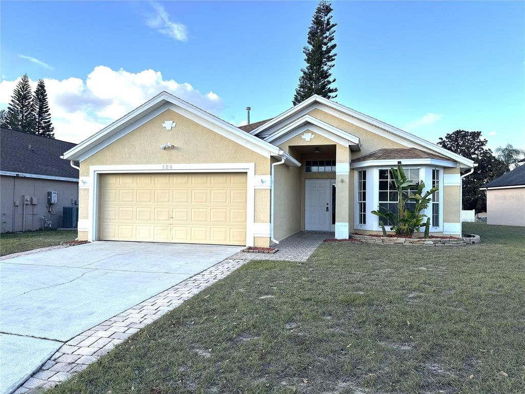 Photo of 128 Queen Mary Drive, Davenport, FL 33837 (MLS # G5106210)