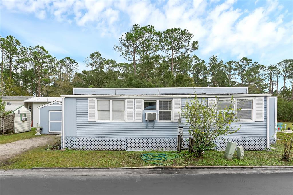 You won't want to miss this renovated mobile home! New roof installed May 2023. Located near the growing prime area of Lake Nona, this is a great option for first-time buyers to make it their own and call it home. Plenty of yard space for gatherings with friends and family along with a shed in the back for extra storage. The community offers a clubhouse, a heated pool, and a gym. This property is located on Lake Center which is part of the Alligator Chain of Lakes. Enjoy fishing or use the boat ramp to launch your boat and relax in the water. Set up your appointment today!