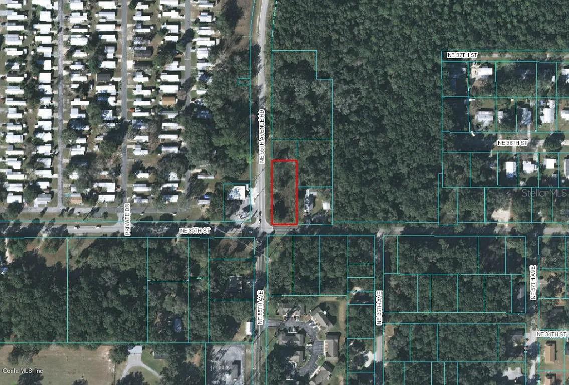 Almost 1/2 acre situated on the corner of NE 35th St and NE 55 Ave. Rd. Conveniently located to schools and shopping . Well and septic on property . Currently zoned R-! , possible to change to commercial