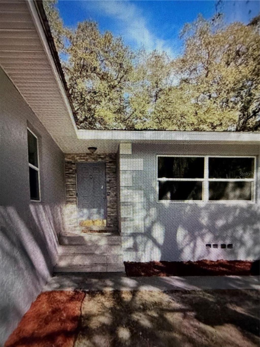 Photo of 14061 SE 117th Place, Ocklawaha, FL 32179 (MLS # O6404278)