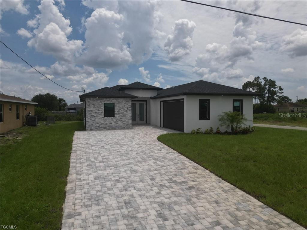 LOCATION, LOCATION, LOCATION!.... READY TO MOVE IN!...Motivated Seller! Be the first to live in this stunning home situated on a spacious corner lot in one of Lehigh Acres' most convenient and sought-after neighborhoods. Thoughtfully designed for modern living, this residence features 3 bedrooms and 2 bathrooms with an open-concept floor plan, high ceilings, and quality finishes throughout. Enjoy added privacy with a Storm Water Canal in rear. Located in a highly desirable area, this home offers quick access to everything Lehigh Acres has to offer—from shopping and dining to parks, schools, and major roadways