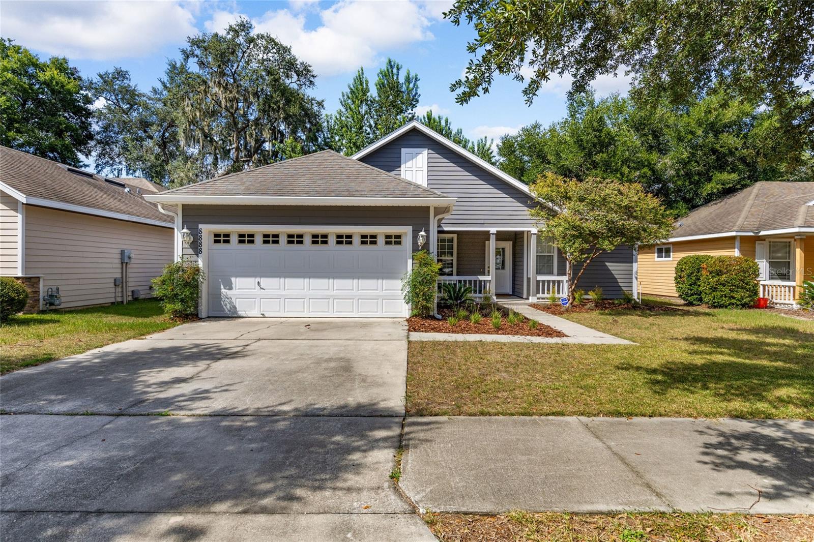 Welcome to this move-in ready 3 bedroom, 2 bathroom home in the highly sought-after Willow Oak Plantation. This thoughtfully designed home offers a 3-way split floor plan and features new upgrades like brand new interior and exterior paint, brand new luxury vinyl flooring throughout (no carpet!), brand new kitchen cabinets and counter tops, and brand new stainless steel appliances.
As you arrive, you’ll be greeted by a charming covered front porch, perfect for sipping your morning coffee or enjoying a peaceful evening sunset. Step inside to find abundant natural light and an open, inviting layout that flows seamlessly into a fully fenced backyard with a paver patio, ideal for entertaining or relaxing.
The spacious living room leads directly to the primary suite, complete with its own walk-in closet and en suite bathroom. On either side of the living room you’ll find additional guest rooms, one perfectly set up for a home office, and another right next to the guest bathroom.
The upgraded kitchen connects to the spacious laundry room, and 2-car garage.
This home combines modern upgrades, thoughtful details, and a warm layout and is located in one of southwest Gainesville’s most sought after pool communities - just minutes from shopping, restaurants, and schools.