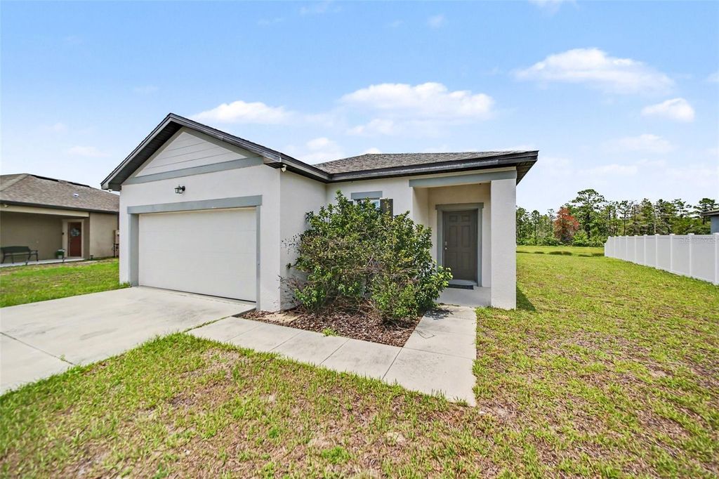 Photo of 1006 Commuter Dr, Deltona, FL 32738 (MLS # O6413938)