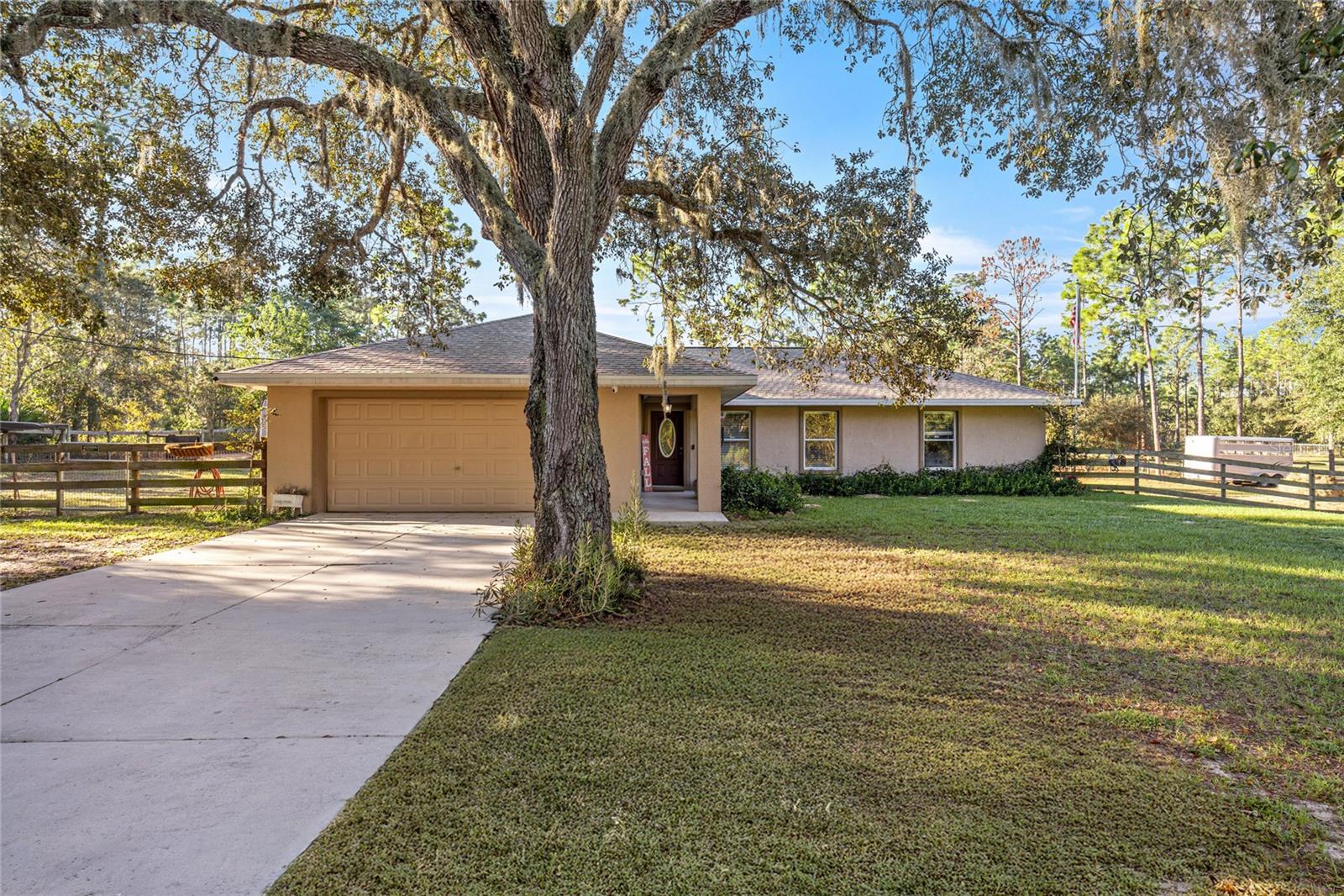 Welcome to your private retreat with no HOA and over 2 fully fenced acres, perfect for a few farm animals or simply enjoying the peace of wide-open space. This inviting 4-bedroom, 2-bath home features a desirable split floor plan, offering both comfort and functionality. Recent updates include a brand new roof, a 2017 AC system, New sliding glass doors, New fridge and a newly screened lanai where you can relax and take in beautiful views of the pastures. Whether you’re looking for room to garden, space for livestock, or simply the freedom that comes with acreage living, this property is ready to accommodate your lifestyle. Enjoy country living while still being close to modern conveniences—this is the perfect place to call home!