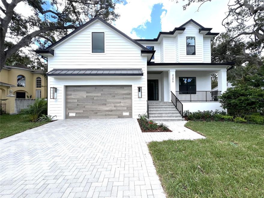 NEW PRICE!  Welcome to this brand new custom-built 5 bedroom, 4.5 bath residence by Momentum Homes, where thoughtful design meets timeless style. As you enter through modern double 6-lite aluminum doors with clear glass, you’re greeted by a spacious grand room featuring oak ceiling beams and a custom dry bar with additional cabinetry and a wine fridge. The open layout flows seamlessly into the chef’s kitchen, complete with a large center island and a generous walk-in pantry. The kitchen is outfitted with premium Thermador appliances, including a natural gas cooktop, built-in double wall ovens, refrigerator, microwave drawer, all integrated into custom shaker-style cabinetry that extends to the ceiling with undercabinet LED lighting and elegant quartz countertops. Additional conveniences include a mudroom entry from the garage. The dining room overlooks the gleaming pool and spa. The office or den is positioned at the front of the home, ideal for the work from home option.   Downstairs offers a private guest bedroom with a full bath that doubles as a convenient pool bath.  The powder bath completes the first floor. 

The upstairs primary suite is a luxurious retreat with an expansive custom closet system and a spa-inspired bath featuring dual sinks, marble flooring, custom marble tile walls, an oversized shower, and a freestanding soaking tub.  Two bedrooms share a Jack and Jill bathroom.  The 5th bedroom has its own ensuite bath.  The versatile bonus room provides flexible space to suit your lifestyle needs.   Antique white wood floors run throughout the home, adding warmth and character.

Sliding glass doors lead from the grand room to a large covered lanai with a full outdoor kitchen, overlooking the sparkling saltwater pool and heated spa. This home was built on an elevated stem wall, offering added peace of mind and protection.  The highly efficient residence offers two 16 SEER heat pump AC units, two tankless gas water heaters, and PGT impact windows. Located in the coveted Mabry/Coleman/Plant school district, this property offers an unmatched combination of luxury, comfort and convenience.