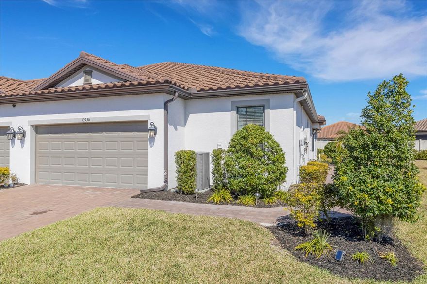 Welcome to your private slice of paradise!

This stunning villa perfectly blends elegance, comfort, and that easy, resort-style living we all love. From the moment you step through the front door, you’ll feel the difference, every detail has been thoughtfully designed to make this home both stylish and functional. Inside, you’ll find beautiful tile flooring throughout, sleek quartz countertops, pre-wired speakers for your favorite tunes, and an extended screened lanai made for relaxing or entertaining. The kitchen is a true showstopper, featuring a unique backsplash, upgraded pull-out drawers, and quartz counters that combine beauty with everyday convenience. The primary suite offers a custom-designed closet with built-in shelving, while the flexible bonus room, complete with upgraded pocket doors, gives you endless possibilities for a private office, cozy den, or extra living space. Other standout features include a glass front door, a spacious laundry room with 42-inch cabinets, a utility sink, and a gas washer/dryer hookup. The two-car garage provides plenty of room for storage and parking. Living in Esplanade at Artisan Lakes means more than just a beautiful home, it’s a lifestyle. This natural gas community offers two resort-style clubhouses with pools and spas, a top-notch fitness center, tennis, pickleball, and bocce courts, scenic trails, dog parks, and a packed calendar of social events. Here, maintenance-free living gives you the freedom to focus on what matters most, whether that’s sipping morning coffee on your lanai, lounging by the pool, or catching up with friends on the courts. Come see for yourself why this villa isn’t just a home, it’s the lifestyle you’ve been waiting for. Located in Parrish, one of the fastest-growing and most desirable areas on the Gulf Coast, you’re just minutes from restaurants, shopping, I-75, St. Pete, and the beaches. Luxury, comfort, and a true Florida lifestyle all come together in this beautiful villa.