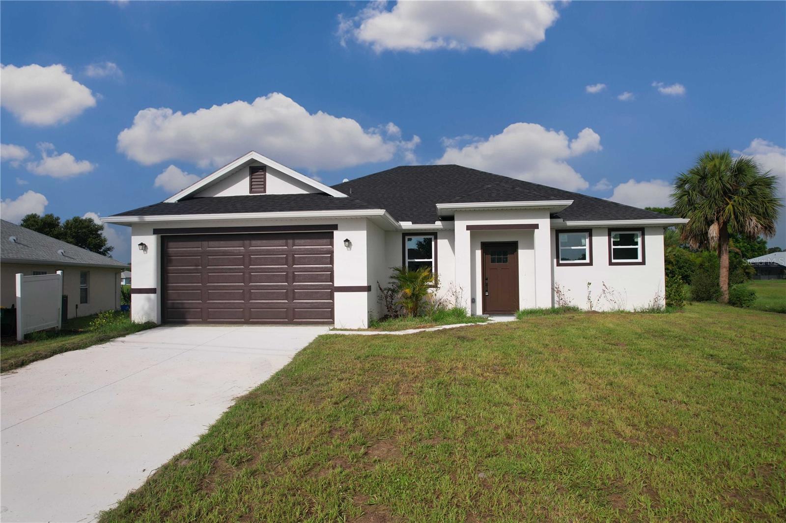 MOVE IN READY! Modern 4-Bedroom Home in Deep Creek – No CDD & Low HOA!
Welcome to this stunning new construction home that’s fully completed and ready for you to move in today! Located in the highly desirable Deep Creek community, this 4-bedroom, 2.5-bath residence offers the perfect blend of style, functionality, and Florida lifestyle. Step inside to find a spacious open floor plan with beautiful ceramic tile flooring throughout (no carpet!), high ceilings, and elegant light fixtures. The modern kitchen is a showstopper — featuring a large center island, stylish backsplash, stone countertops, and ample cabinetry, ideal for entertaining or family gatherings. The primary suite offers a spa-like experience with dual vanities, a walk-in tiled shower, and a private water closet. Enjoy sunny Florida days in your private backyard, perfect for outdoor dining, play, or relaxation. Ideally situated just minutes from I-75, this home provides quick access to Downtown Punta Gorda, Fishermen’s Village, Peace River Botanical Gardens, and some of the best beaches on Florida’s Gulf Coast including Englewood Beach and Boca Grande. You’ll also be close to local golf courses, parks, shopping centers, and airports in Ft. Myers and Punta Gorda. With a low annual HOA and no CDD fees, this home is perfect for year-round residents, snowbirds, or investors looking for quality new construction in a growing community. Schedule your private showing today — your Florida dream home is ready and waiting!