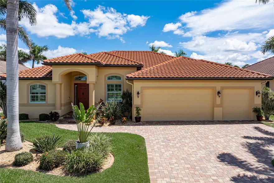 SAILBOAT ACCESS STUNNER IN PUNTA GORDA ISLES - Nestled in the original sailboat area of Punta Gorda Isles, this 3 bed/3 bath, custom-built, waterfront home offers the ideal blend of luxurious living and quick, deep-water boating access. With a 45-foot concrete dock, 14,000 lb boat lift, and located just a few lots from Charlotte Harbor, it’s a boater’s paradise. The home's east-facing backyard ensures you’ll enjoy brilliant sunrises and shaded afternoons poolside. Tropical landscaping and a paver driveway welcome you home. Step inside to the spacious, open floor plan that seamlessly connects the great room, dining area, kitchen and breakfast nook. It creates the ideal setup for entertaining. The disappearing sliding glass door in the great room effortlessly extends the living space out onto the lanai. The chef’s kitchen is both functional and beautiful, featuring rich wood cabinetry, granite counters, tile backsplash, stainless appliances including raised dishwasher, under cabinet lighting & an angled breakfast bar that invites you to pull up and have a seat. The kitchen also features a dry bar and large closet pantry. The large breakfast nook features a mitered bay window that boasts an unobstructed view of the pool and canal beyond. Architectural details include interior columns, arches, crown molding, double tray ceilings, and plantation shutters. The master retreat offers private access to the lanai, views of the pool and canal plus two large walk-in closets and a spa-like master bath with dual sinks, corner tub, tiled shower plus a linen closet and private WC. The split bedroom layout provides privacy for owners and guests alike with two guest bedrooms. One guest bedroom features a private en-suite (Jr master suite) and offers walk-out access to the lanai -perfect for giving your guests a taste of Florida living. The en-suite bath doubles as a pool bath with access to the lanai. Outdoor living shines here. The lanai features a brick paver deck & tongue-and-groove ceiling details in two separate, covered spaces that are ideal for dining and lounging. Both covered areas overlook the in-ground, heated, saltwater pool. Step out of the lanai into a well-manicured, lush backyard that leads to your extended, concrete dock. Water & electric hook-ups are available dockside. Keep your boat docked in your backyard. Reach open water in a matter of minutes from here. Other amenities include an attached, 3-car garage w/overhead storage, in-ground sprinklers w/NEW Rainbird controller, whole-house hurricane protection w/impact windows & accordion shutters on the lanai, M&S intercom/stereo system, and in-ceiling surround sound speaker system. Home has Sentricon pest defense system w/contract through March 2026. Although known for boating, Punta Gorda also boasts a lively art & music scene with a variety of art fairs & musical festivals held downtown. Miles of sidewalks throughout PGI connect you to Fishermen's Village, numerous parks & historic downtown. Shop in the boutiques & specialty stores, wander through the weekend farmers' market or enjoy waterfront dining. It's all possible here. Kayaking, paddleboarding, golf, tennis & pickleball keep you active & involved. Flood insurance is transferable to new owner. Don't miss your chance to start living the Punta Gorda Isles lifestyle. Make an appointment today. You won't be disappointed.