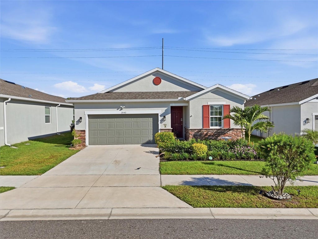 Photo of 1042 Heirloom Drive, Haines City, FL 33844 (MLS # O6444866)