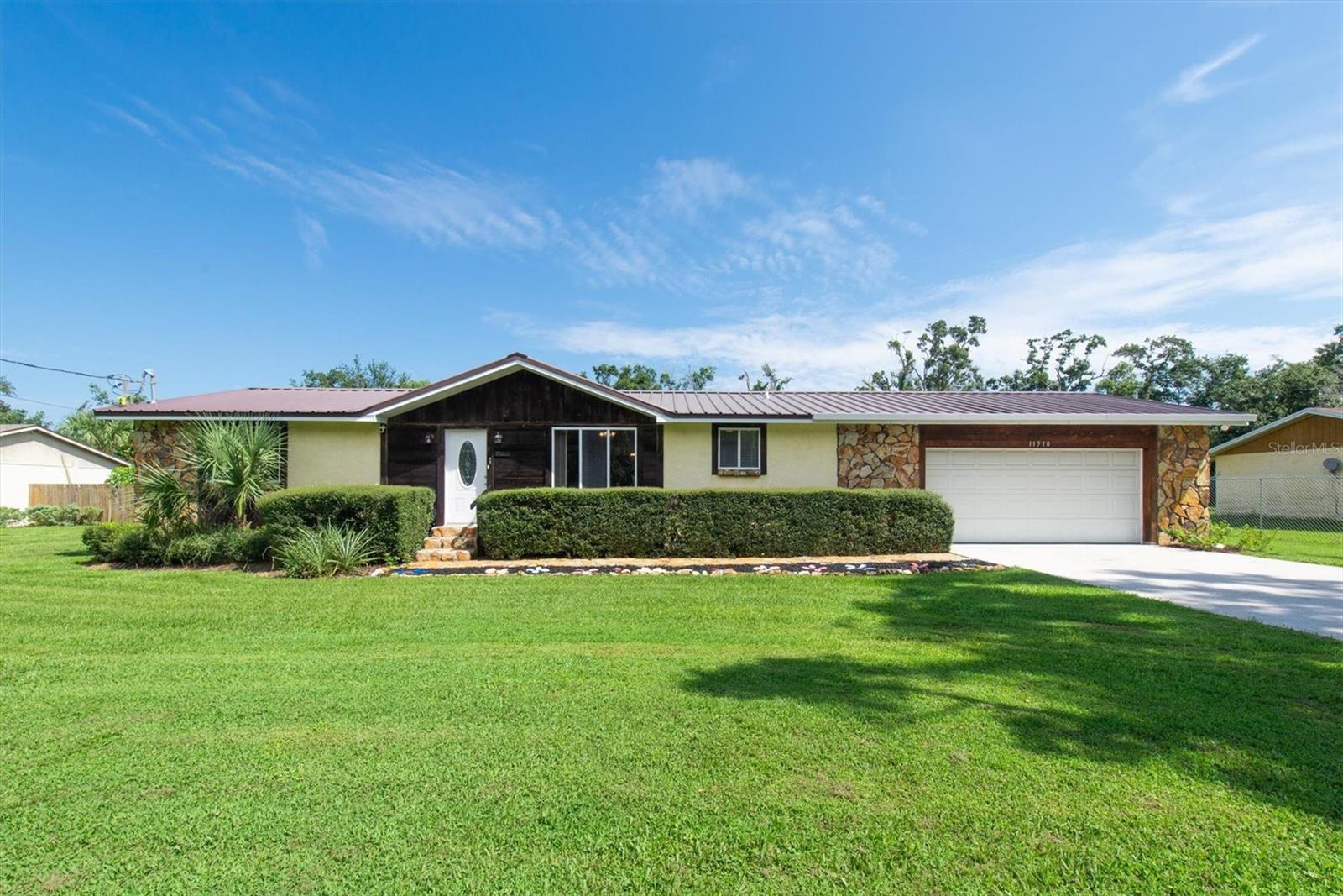 WELCOME HOME TO PRIVACY AND COMFORT! Situated on OVER 1/2 AN ACRE, this three-bedroom, two-bathroom ranch-style beauty is truly one-of-a-kind. With nearly 2,000 square feet of sprawling living space and ALL OF THE OUTDOOR EXTRAS, this home has been IMPECCABLY cared for and it shows. Enter to find open living space with TONS OF NATURAL LIGHT and a thoughtful layout presenting a cozy kitchen as the center of the home. The primary bedroom and en-suite can be located opposite the secondary bedrooms and additional full bath giving a true split bedroom option. Relax and spread out with ease as the floorplan flows naturally to the GREAT ROOM boasting a wood burning fireplace. Truly enjoy every season as you step through the French doors into the OVERSIZED FLORIDA ROOM which is fully enclosed and air conditioned. The covered, enclosed lanai with SALTWATER POOL can be accessible from the Florida room making entertaining a breeze! No detail was overlooked with this well-maintained property. UPGRADES include a newer central A/C, new flooring and paint throughout, as well as newer windows and appliances. BRING ALL THE TOYS! No need to pay for off-site storage with a dedicated 24’ x 35’ RV / BOAT PARKING right on your own property! With a 30-amp breaker and custom drain pit for flushing your boat after a day on the water, the convenience is all here! Hobby enthusiasts will love the 22’x 30’ detached GARAGE AND WORKSHOP complete with electric and air compressor. An additional 10’x16’ shed is a bonus for extra storage. KEY FEATURES include a durable METAL ROOF, remote-operated gated access with twenty-foot extension to allow easy entry and exit of larger vehicles and trailers and so much MORE! NO FLOOD ZONE, NO CDD, NO HOA! Zoned for HIGHLY RATED SCHOOLS as well as numerous school-choice options, this property is close to excellent dining, shopping, and recreation. Enjoy quick access to employment corridors, expressways, international airports, MacDill Air Force Base, and an array of top destinations in any direction. Love the Florida lifestyle and take advantage of world-renowned beaches, theme parks, world-champion sports teams, open-air markets & festivals, nature parks, waterfront entertainment & activities. Close to esteemed medical centers, VA Hospitals, colleges, and universities. Enjoy the comfort of quiet living with the convenience of location - this is everything you’ve been waiting for!