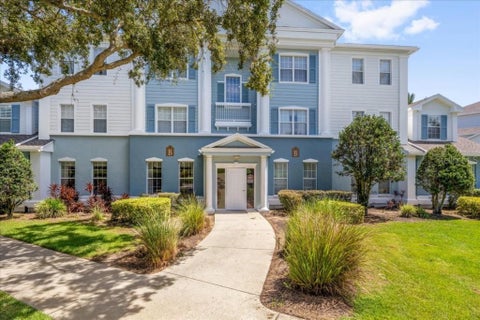 Photo of 7697 Heritage Crossing Way #101, Reunion, FL 34747 (MLS # O6440398)