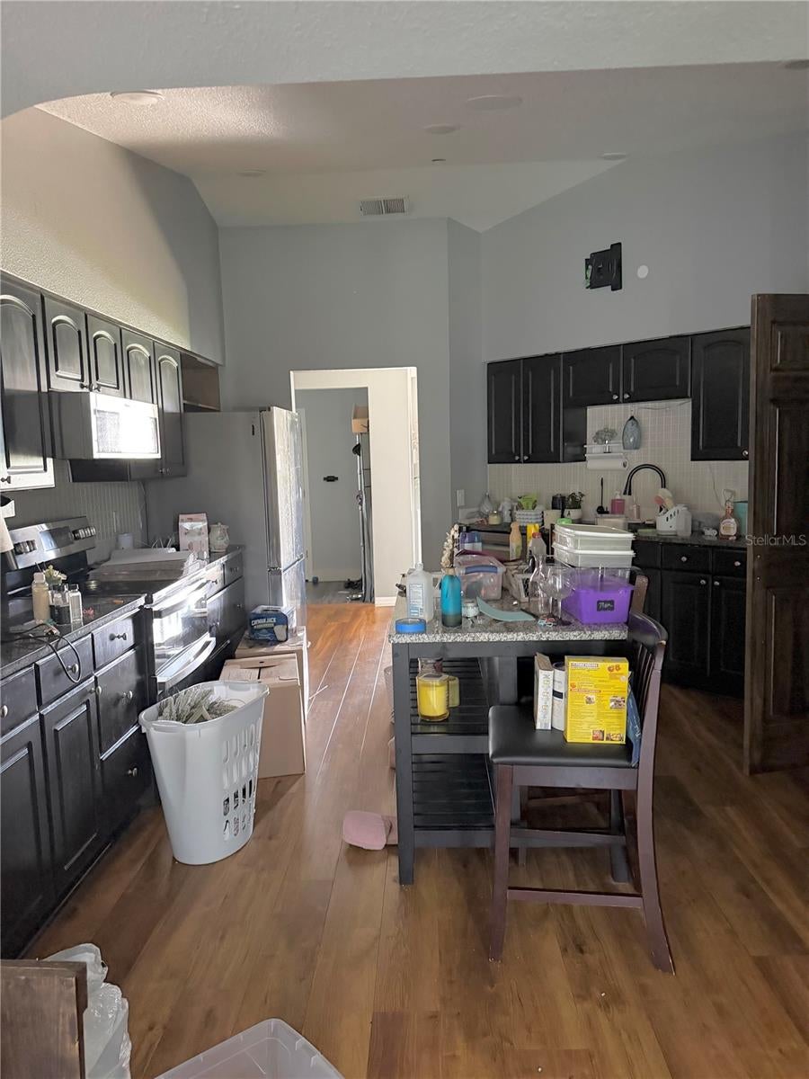 Photo of 613 Berkley Pointe Pass, Auburndale, FL 33823 (MLS # TB8523405)