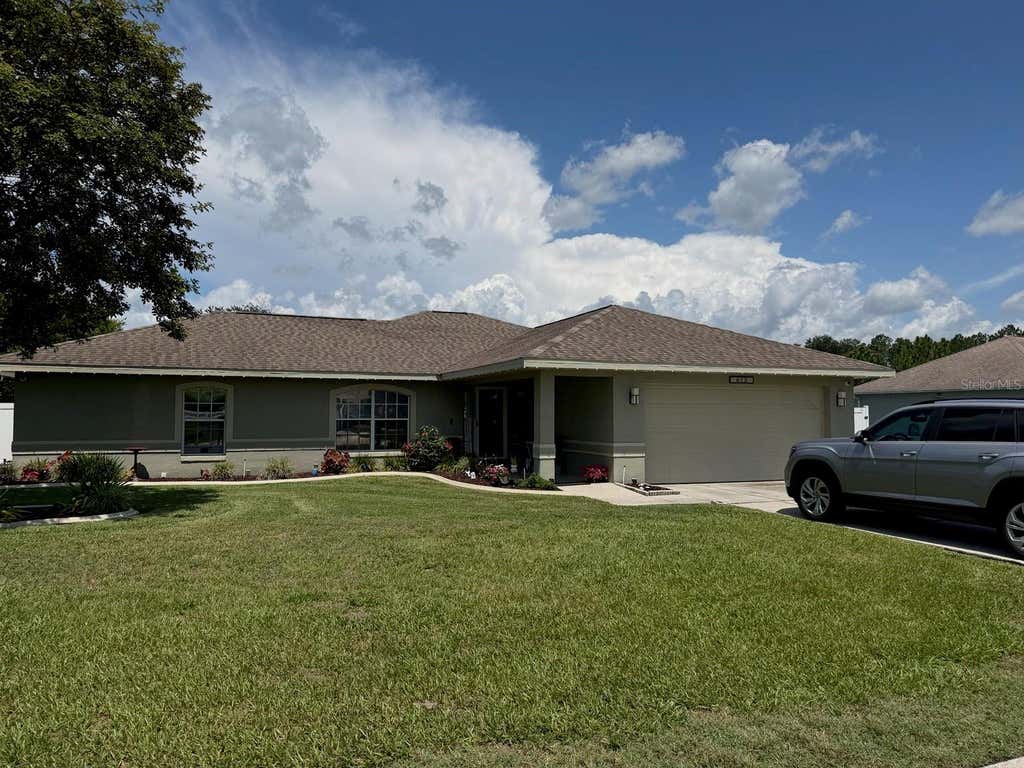 Photo of 613 Berkley Pointe Pass, Auburndale, FL 33823 (MLS # TB8523405)