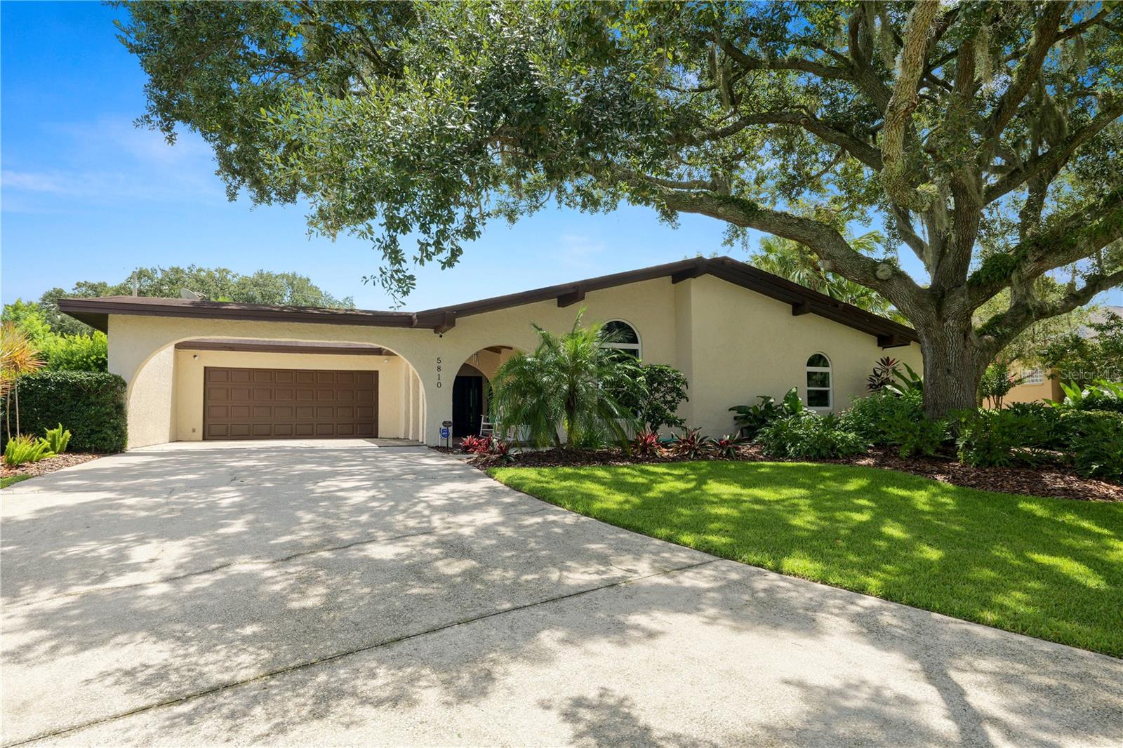 Welcome to your 3 bedroom, 2.5 bathroom POOL home, with NO HOA, located in the heart of south Lakeland, with easy access to shopping, dining, and major roadways. This exceptional home has so much to offer! The home has new windows and sliding doors throughout, and the whole house has been replumbed, and a NEW ROOF will be installed at or before closing! Arriving at the home, you’ll appreciate the landscaped yard and covered front porch with wood beam ceilings. Stepping inside, you’ll find a generous sized living room with fireplace, plantation shutters and vaulted wood beamed ceilings! The perfect spot for relaxing. Entering into your family room, you’ll find new flooring throughout, along with a completely remodeled kitchen featuring granite countertops, new cabinetry, and stainless steel appliances. There’s also a large island, the perfect spot for entertaining. The primary suite is spacious and filled with natural light, while the en-suite offers a dual sink vanity, large Roman style soaking tub, and a stand up shower. The remaining 2 bedrooms are generously sized and share the main hall bathroom with a single sink vanity and tub/shower combo. Stepping through your new sliding doors from the family room, you’ll find your outdoor oasis! A large fully screened in patio and newly refinished pool and decking. Entertaining is a breeze with the granite topped bar! This home also features a newly added pool bath as well as an indoor laundry room. There is a storage shed outside for additional storage needs. This home has so much to offer, schedule your private showing today!