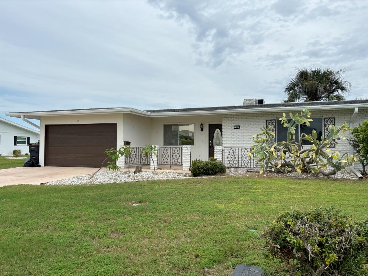 Villa in Sun City 2 bedroom 2 bathroom with an over sized garage. Open floorplan makes this property enjoyable along with a florida room. Open kitchen with plenty of counter space. Inside laundry area and a utility room. Monthly HOA fee includes lawn Maintenace and water. Come enjoy this community with many activities... indoor and outdoor pools, clubhouses along with group activities for hobbies and fitness centers. This Villa property does adjoin the neighboring Villa that is also for sale in case a family or friends would like to have two properties next to each other.