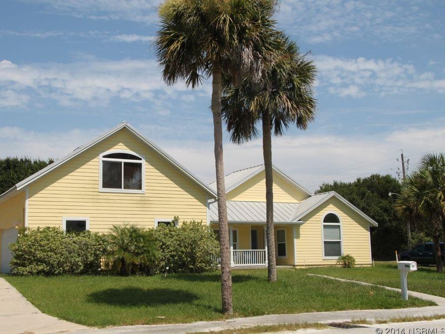 Key West beach style home at walking distance to elementary school and beach!! Newer corner lot home built in 2006. Home offers an amazing living space with an open floor plan, high vaulted ceilings, modern lighting throughout, lots of windows allowing natural light. In the heart of the home is a gourmet kitchen with granite counter tops, stainless steel appliances and a focal wall-mount range hood, as well as maple cabinets. Wood burning slate fireplace, ceramic tile and oak wood floors throughout the home. French doors in living area and master suite. Master bathroom features travertine tile and spacious walk-in closet. All other bedrooms also boast of generous closet space.  Other features include metal roof, poured concrete walls, hardy board siding and stucco, 2 a/c units, all windows are up to 2004 hurricane code and over-sized 2 car garage. On the 2nd level, you will find a huge bonus room that can be used as a 5th bedroom, office or family/play room. There is also room for a pool. Not only this home is functional but offers a cozy and homey feel! A must see! All measurements are approximate. ;Water: City