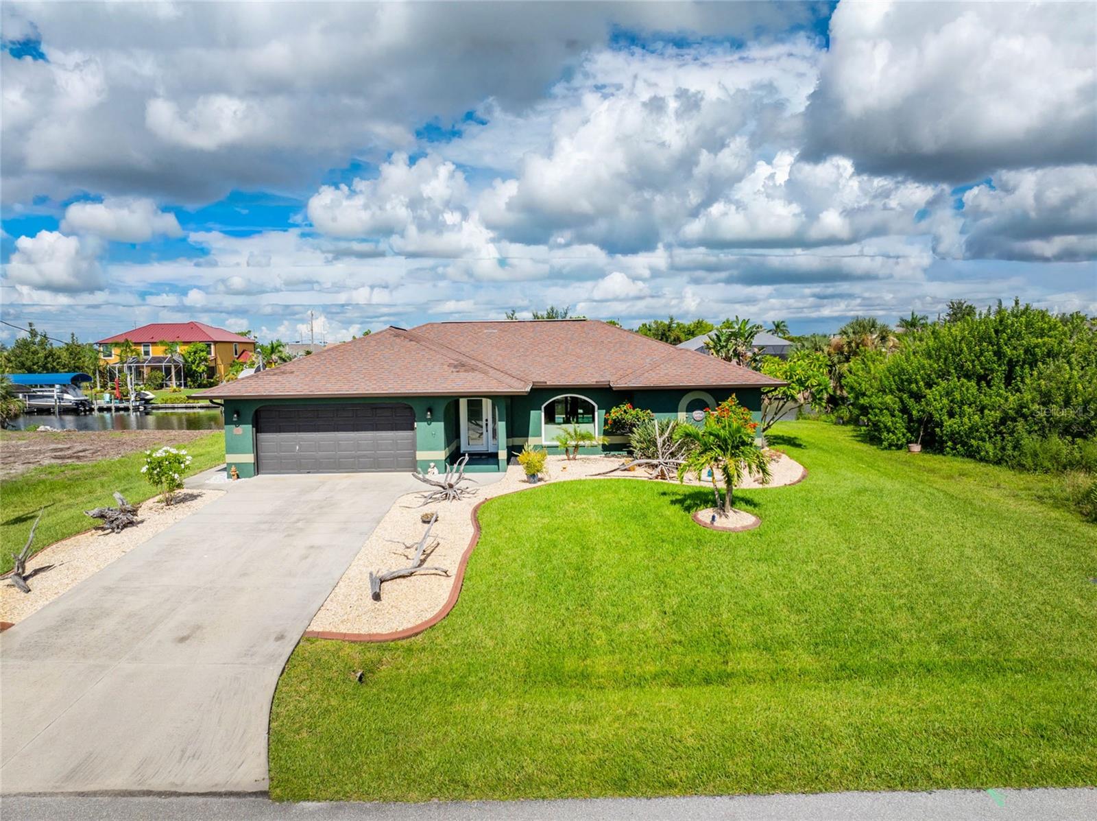 Welcome to South Gulf Cove. A highly desired community for boater enthusiast offering an array of amenities and direct canal access to Intracoastal Waterway. This Lovely home offers a comfortable living experience with 3 bedrooms and 2 bathrooms split floor plan with a large lanai and beautiful pool. The attached 2 car garage provides ample space for vehicles and storage. Home features irrigation system, curbing around the home, landscaping, Concrete Seawall, Electric available for Boat Lift along with water. All windows updated with impact windows for a piece of mind. South Gulf Cove is a Voluntary Association offering clubhouse, walking path, park, and learning garden. Don't miss your opportunity to own your piece of Paradise. Come Live the Florida Lifestyle. Call and make your appointment TODAY!!!