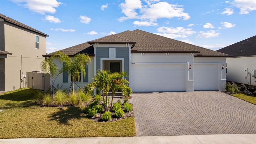 Experience elevated comfort and style in this brand-new 2025 Lennar Home, offering 4 bedrooms, 3 bathrooms, an office/flex room, and 2,610 sq. ft. of beautifully designed living space in the desirable Stonegate Preserve community.

From the moment you arrive, the brick-paver driveway and manicured landscaping create a warm, welcoming first impression. Step inside to a bright foyer featuring wood-look ceramic tile, elegant coffered ceilings, and thoughtful architectural details throughout.

Toward the front of the home sits a spacious bedroom with access to a full bathroom featuring dual sinks and a partition for added privacy—ideal for guests or multigenerational living. Down the main hallway, you’ll find two additional bedrooms, each with plush carpeting and generous closets.

Continue on to discover a stylish dry bar with a wine refrigerator, plus a built-in workstation perfect for remote work or homework. Nearby, the laundry room offers a utility sink and extra storage. A modern second full bathroom sits adjacent to the fourth bedroom, complete with an upgraded shower.

The heart of the home is the expansive open-concept living and dining area, highlighted by another coffered ceiling, a large ceiling fan, and sliding glass doors that lead out to the covered patio—perfect for indoor-outdoor living and entertaining.

The chef’s kitchen is a true showstopper, equipped with stainless steel appliances, including a gas stove, range hood, dishwasher, microwave, and built-in oven. Enjoy a walk-in pantry, a large island with seating, a dedicated coffee bar, and abundant cabinet and counter space.

Retreat to the luxurious primary suite, featuring coffered ceilings, a massive walk-in closet, and a spa-inspired en suite bathroom with dual vanities, a modern walk-in shower, a soaking tub, and a private water closet.

An additional office/flex space provides room for a home gym, playroom, or quiet workspace. The home also boasts a three-car garage and a fully fenced backyard, offering plenty of room for pets, gardening, or outdoor relaxation.

Residents of Stonegate Preserve enjoy resort-style amenities including a clubhouse, sparkling pool, fitness center, pickleball court, and a fully equipped playground. The location provides quick access to the stunning beaches of Anna Maria Island (just 30 minutes away), upscale shopping at the Ellenton Premium Outlets, and local entertainment such as the nearby marina featuring Pier 22 restaurant. Schedule your private showing today!